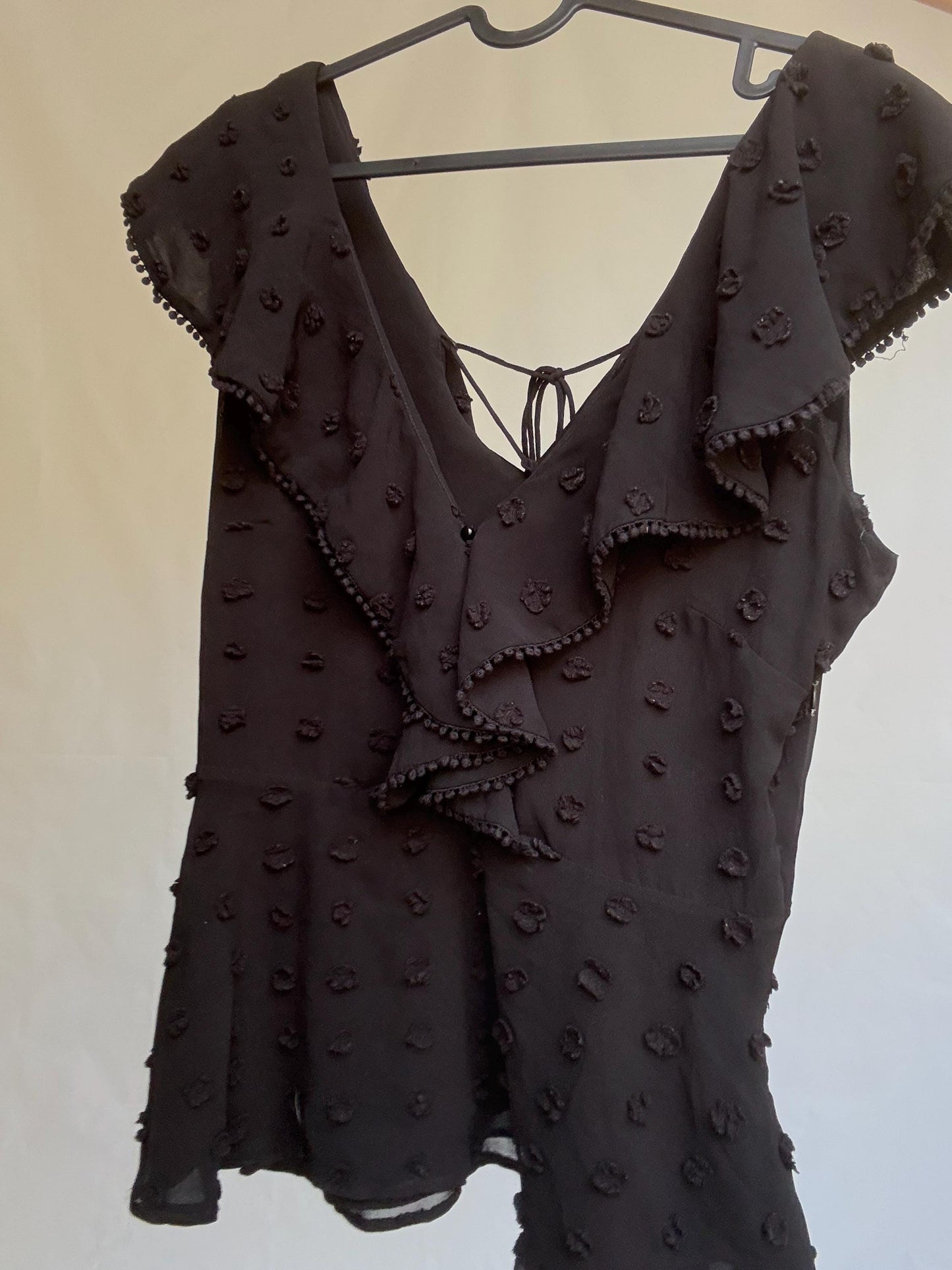 Uterqüe black blouse with ruffled back tie, textured dot fabric, romantic v-neck top with side zip, size M