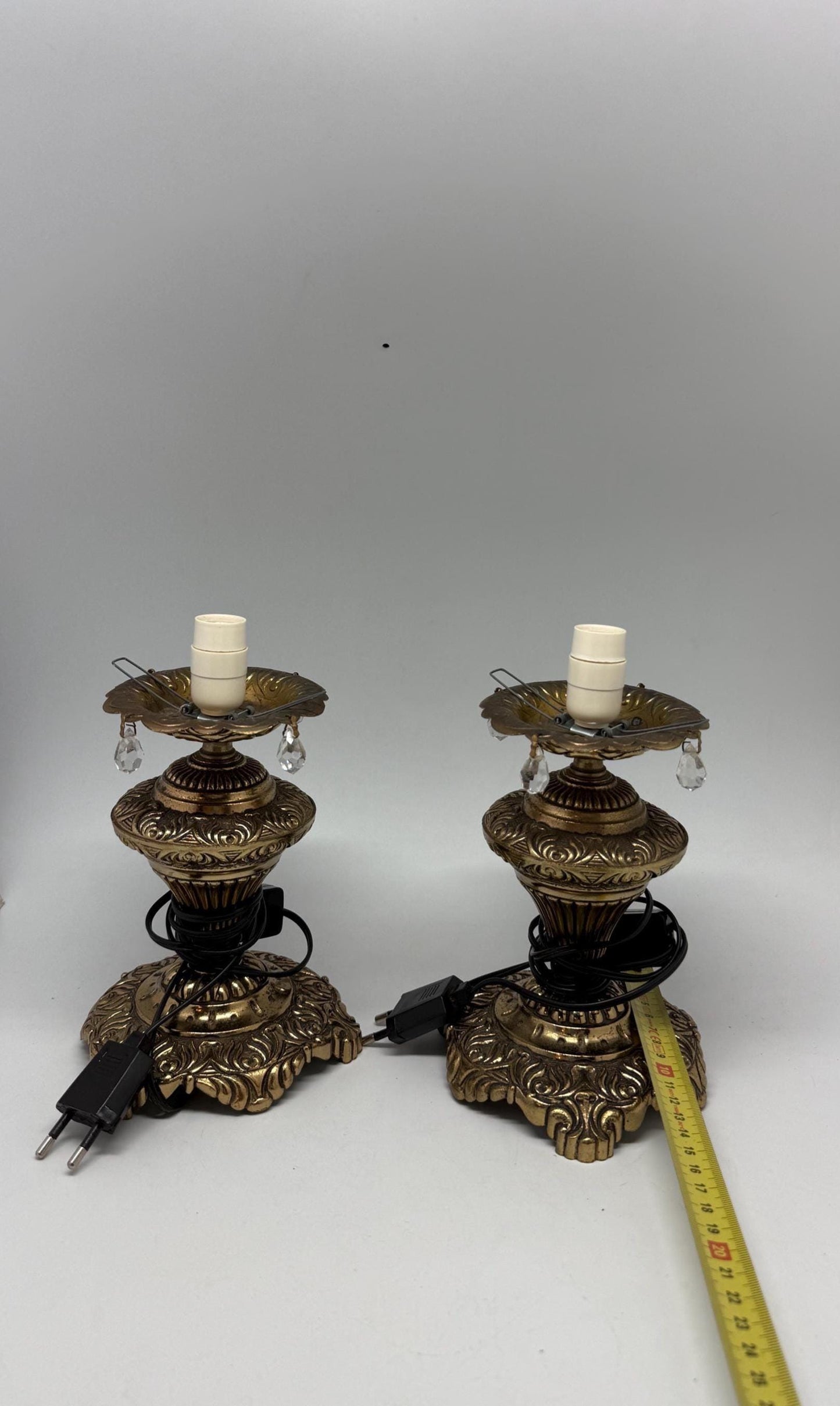 Vintage pair of ornate table lamps, metal with brass, tone finish, candle holders, hanging crystal accents, elegant antique style