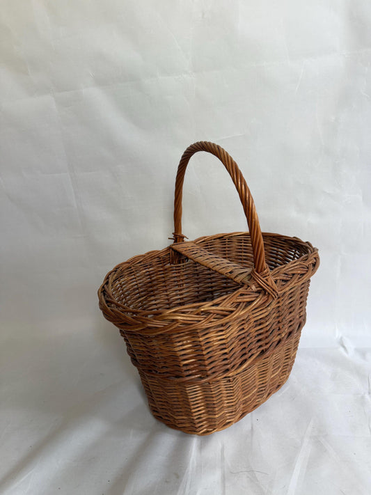 Rustic rattan basket, natural woven design, classic silhouette, autumn basket, crisscross pattern, rustic charm, picnic or storage