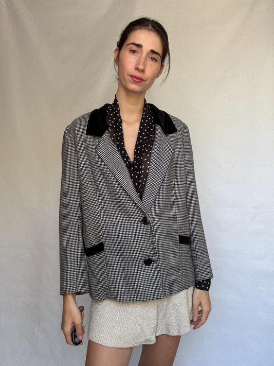 Vintage black and white houndstooth blazer, likely wool, tailored fit, velvet collar, double button cuffs, dark academia, US L