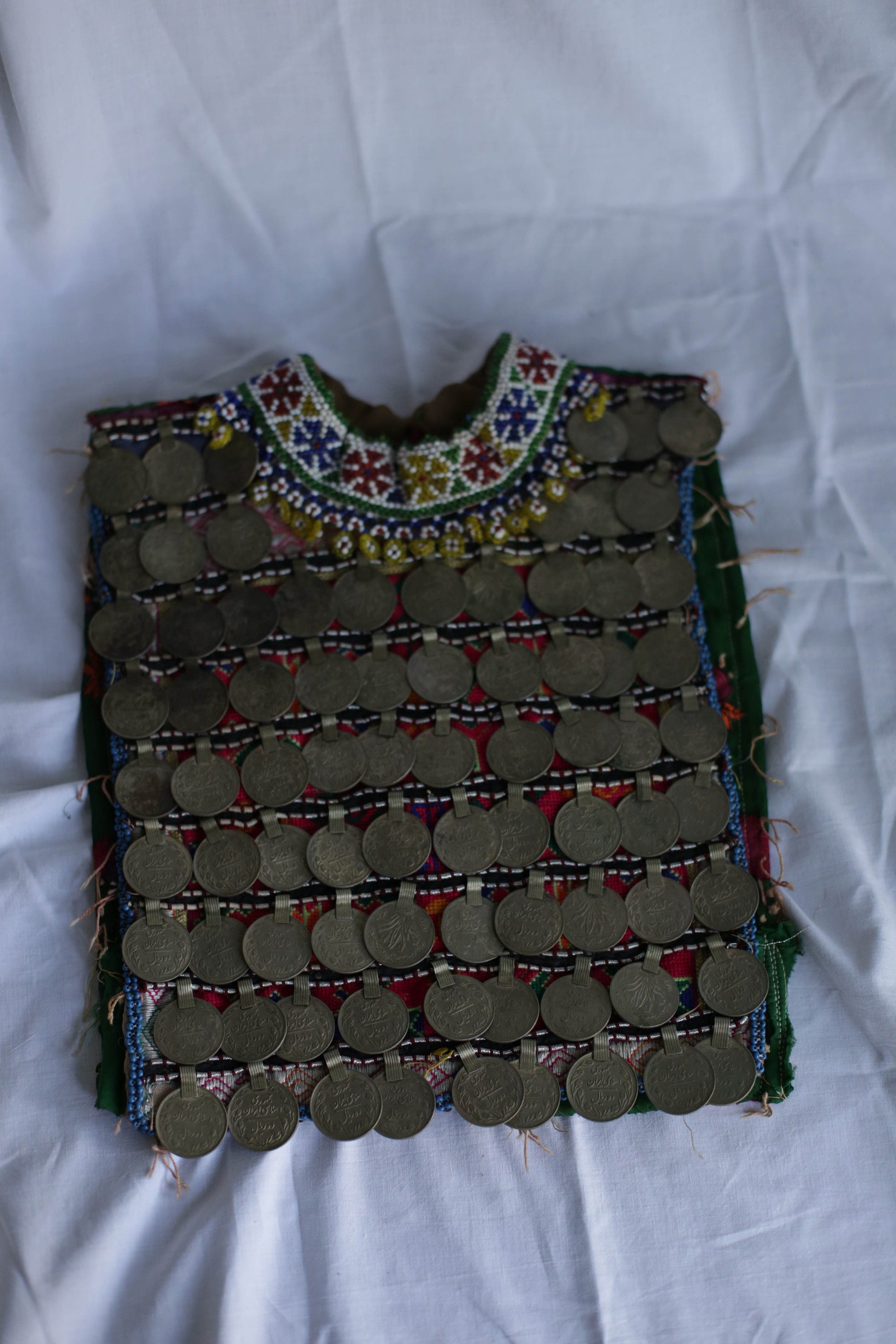 Afgan Relic, Antique handmade Afgan childrens bodice decorated with copper rial coins, Ethnographic