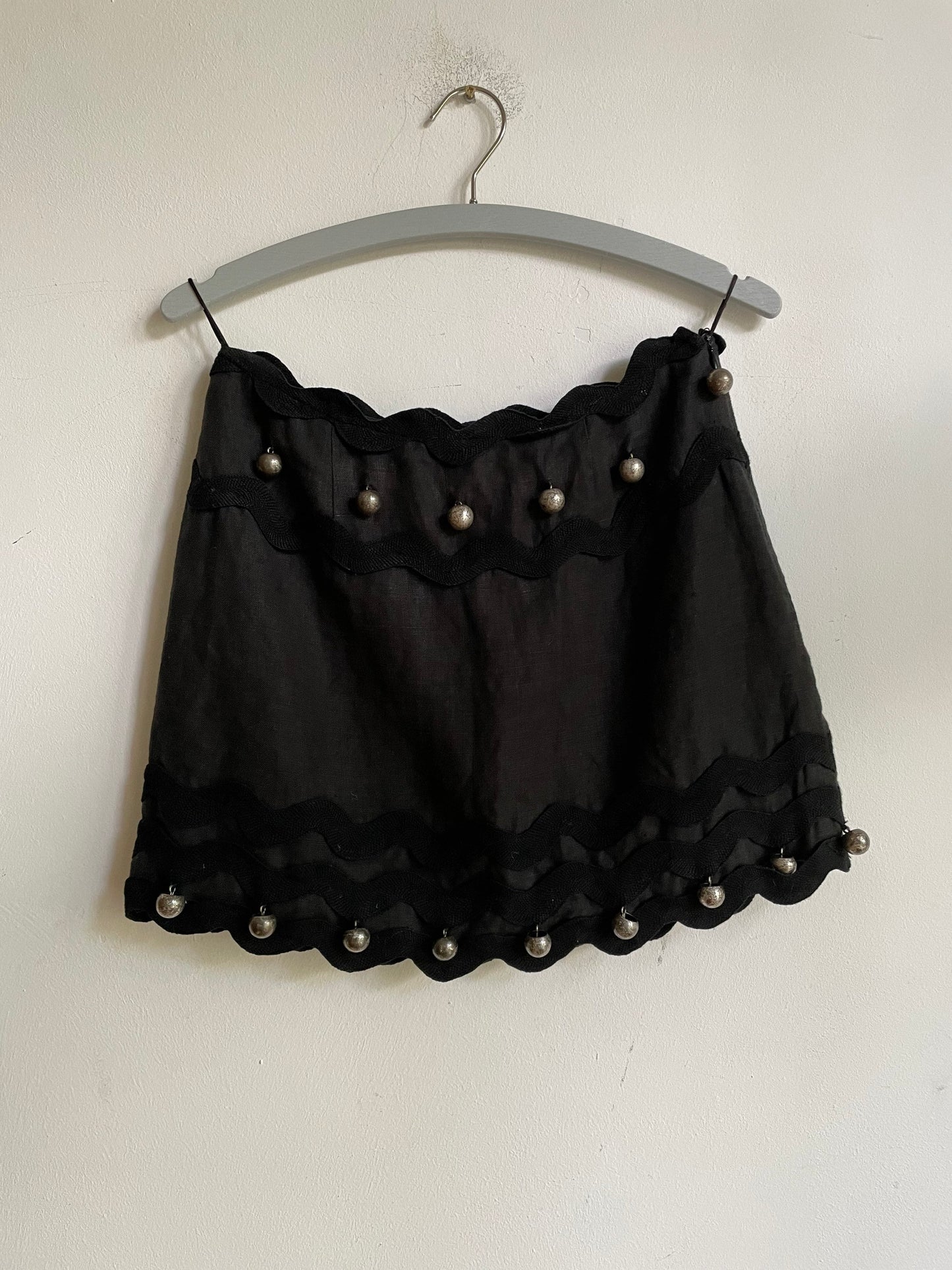 Vintage Moschino black linen mini skirt – silver jingle ball trim, size 36 fit, playful and rare piece, cheap and chic mini skirt, designer