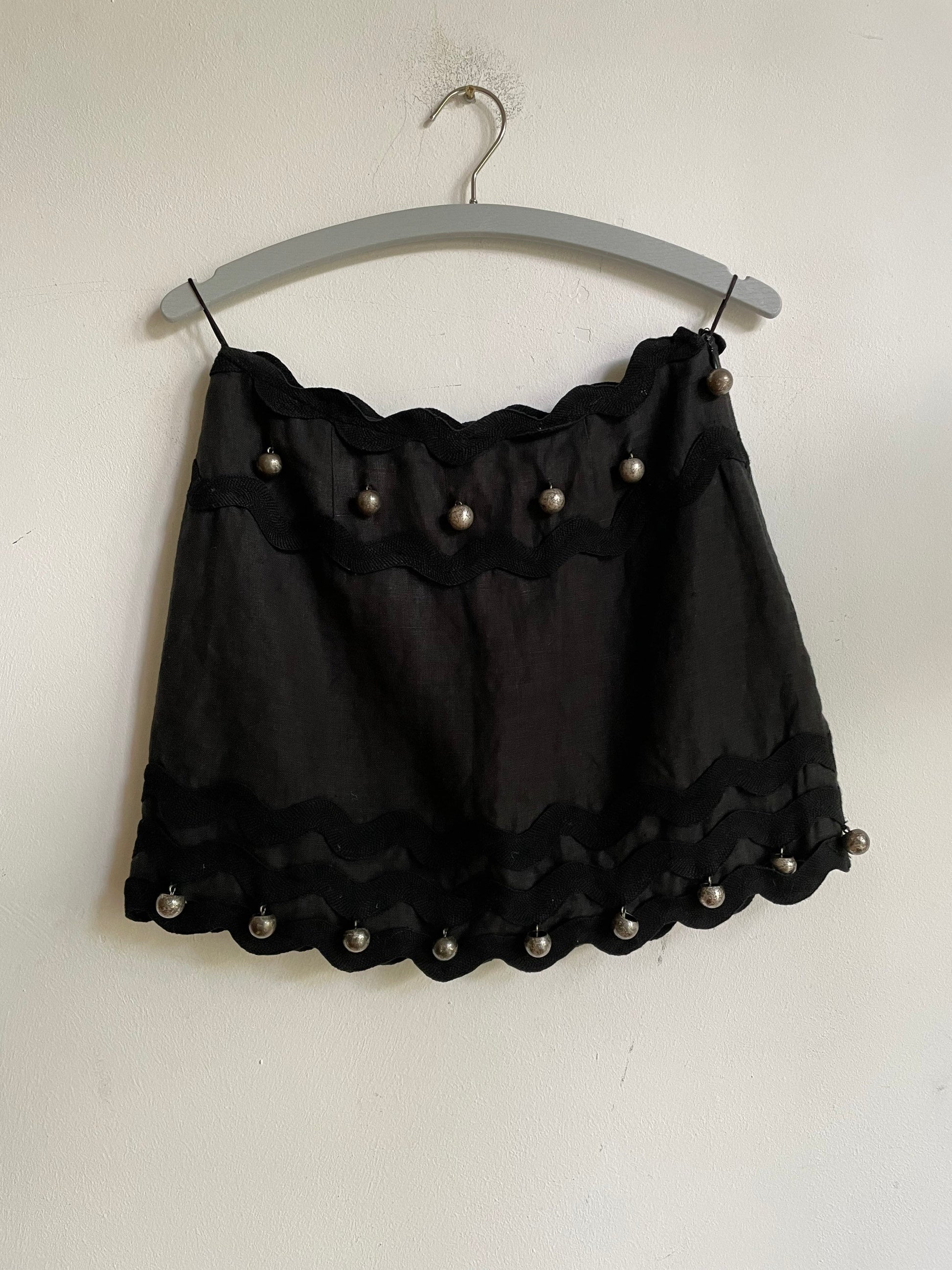 Vintage Moschino black linen mini skirt – silver jingle ball trim, size 36 fit, playful and rare piece, cheap and chic mini skirt, designer