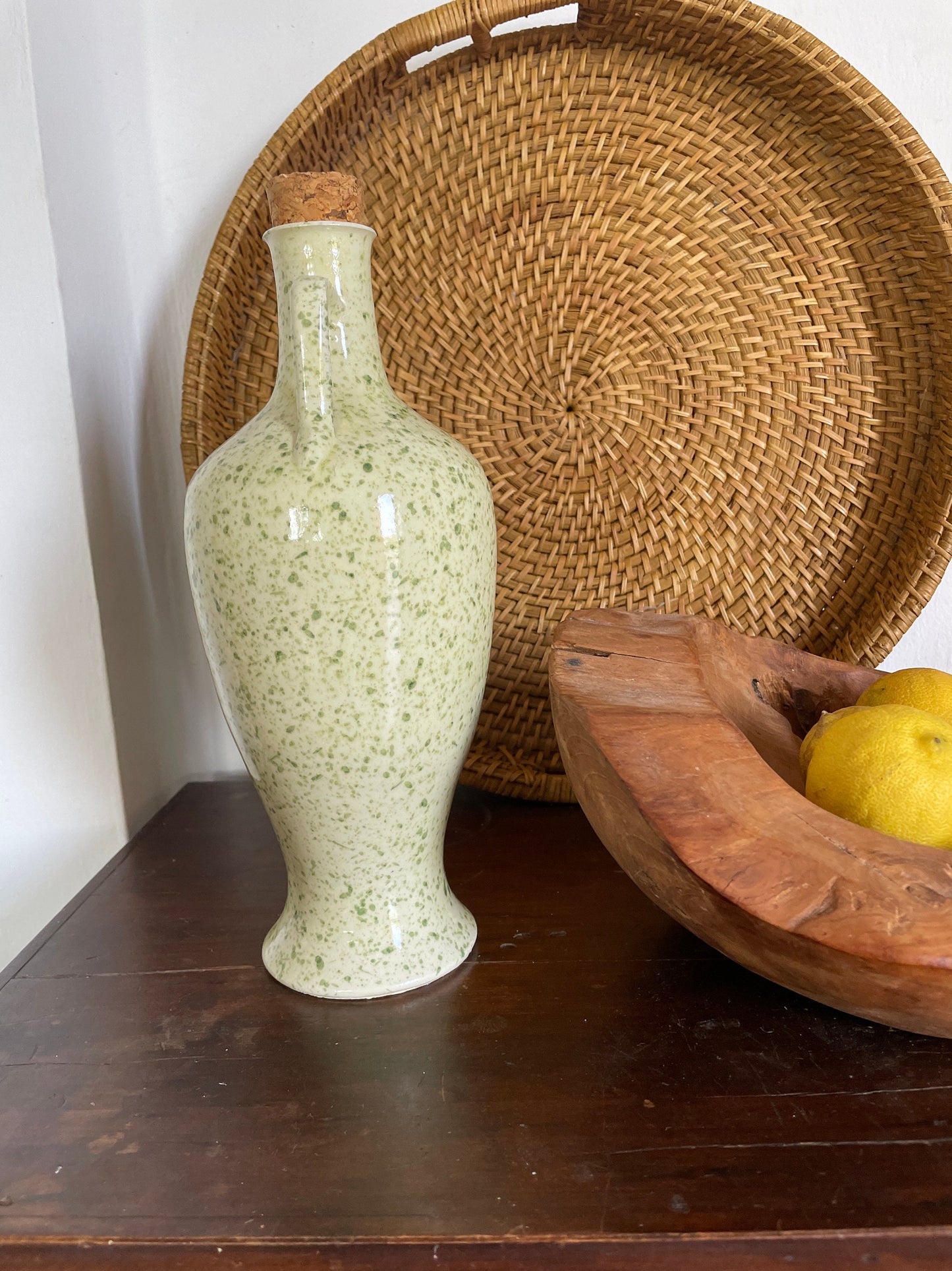 Vintage Green Speckled Oil Pitcher — fabric close-up