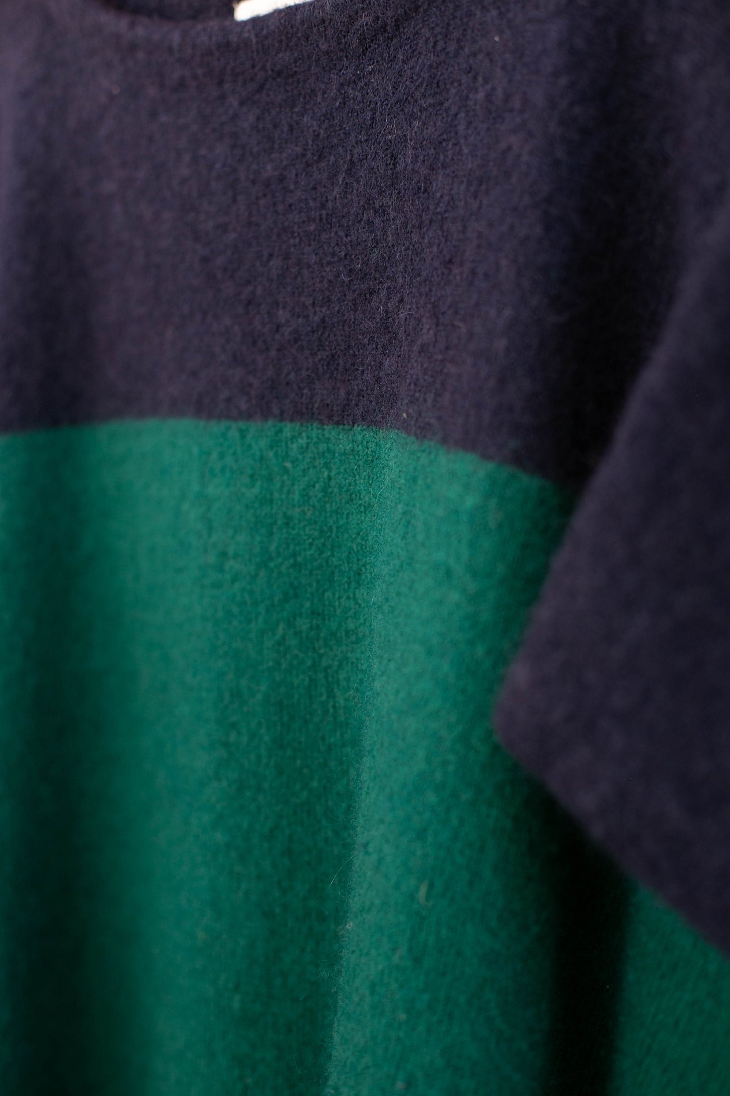 Wool poncho in navy blue and green