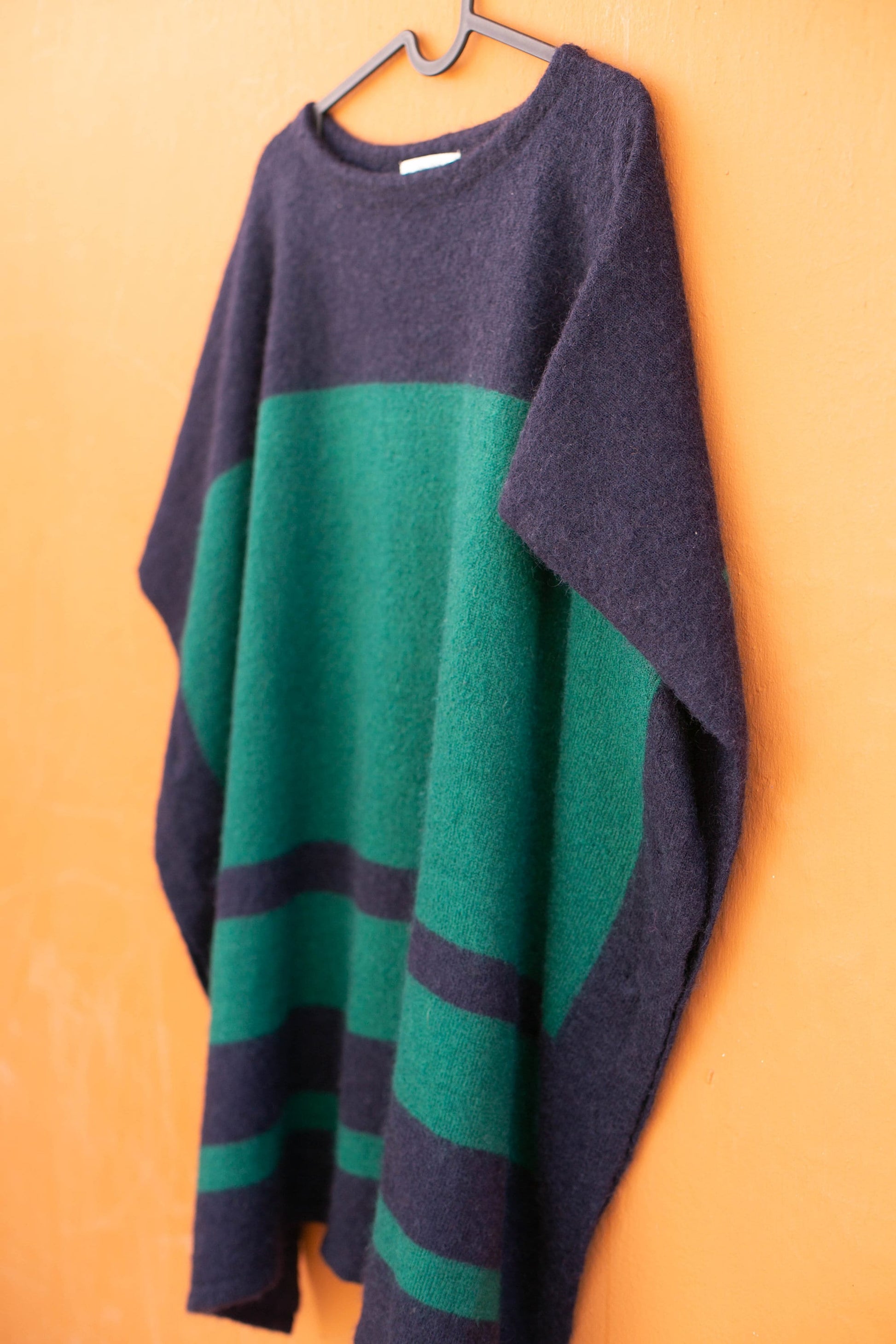 Wool poncho in navy blue and green