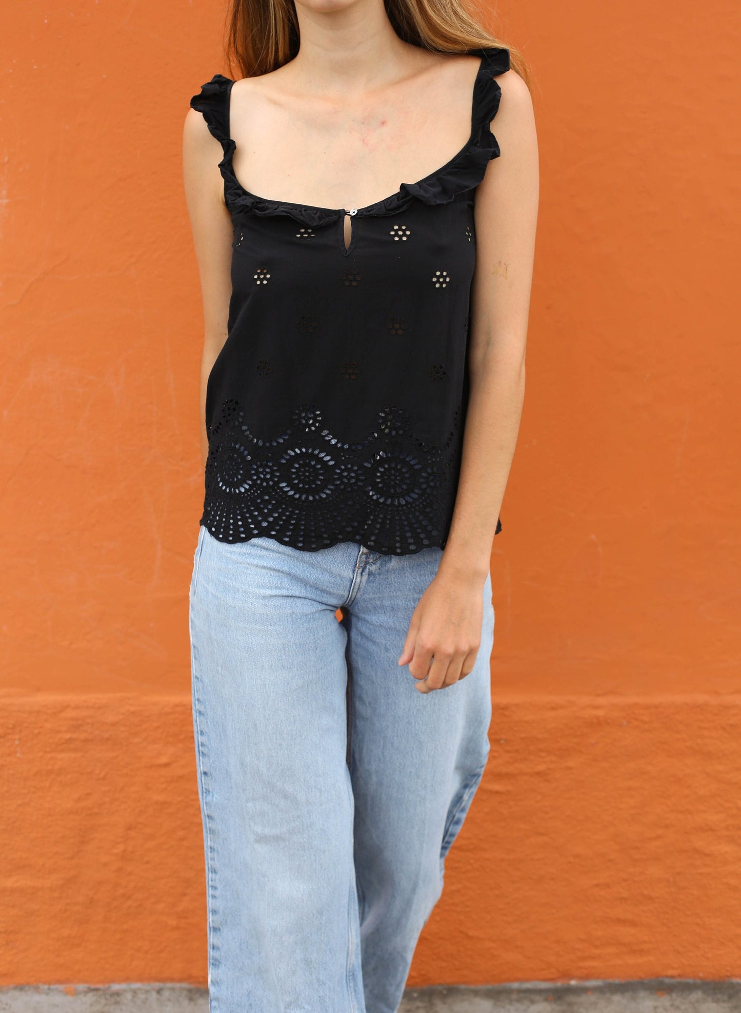 black eyelet camisole by brand Guess. elegant open  neckline.