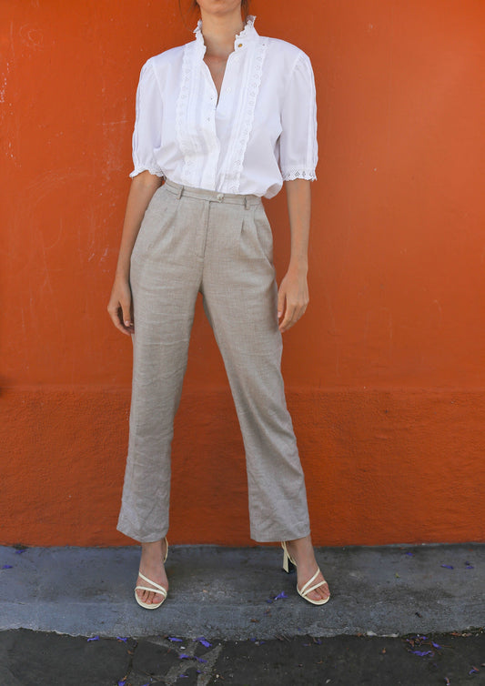 vintage white puff sleeve button down blouse with ruffled hems and detailing.