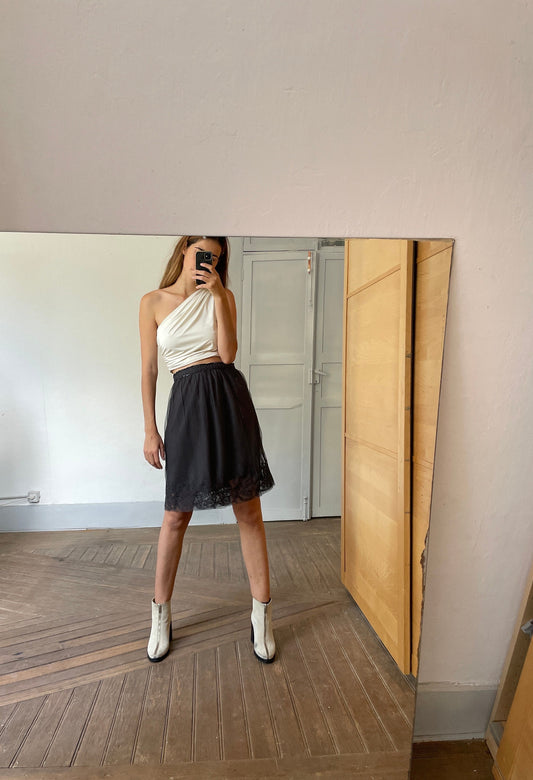 Black high waist fitting skirt with lace top layer and embelissments. Romantic aesthetic.