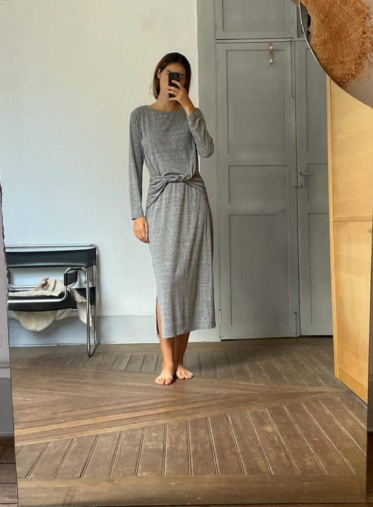 Long grey dress with long sleeves.