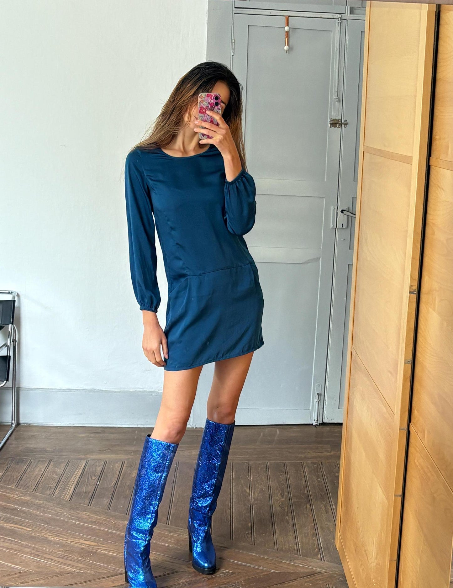 Sisley petrol coloured mini dress with long sleeves and pockets.