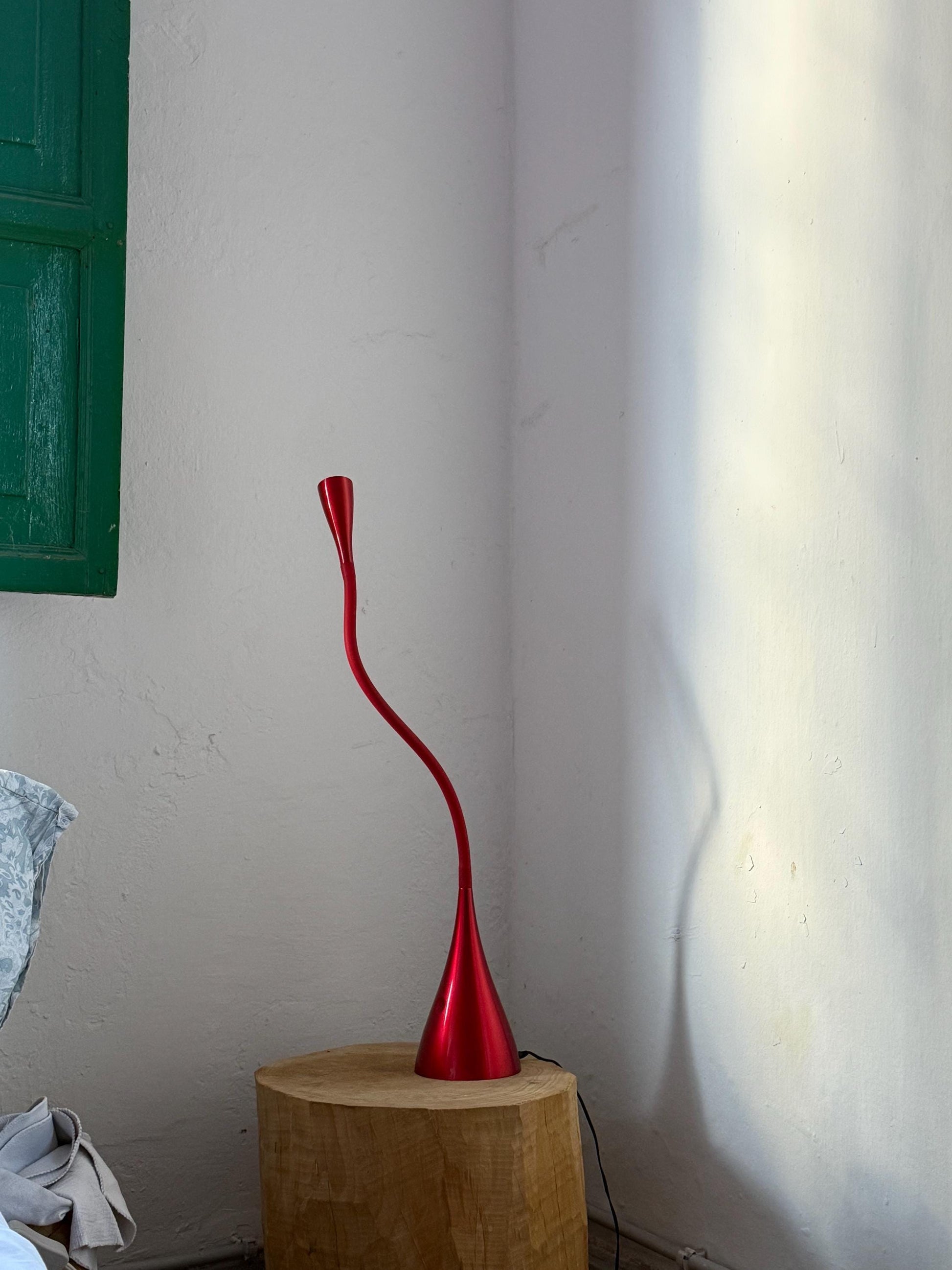 Sculptural red wavy table lamp with flexible neck, touch switch, modern space-age vibe, bold statement lighting, sturdy vintage build