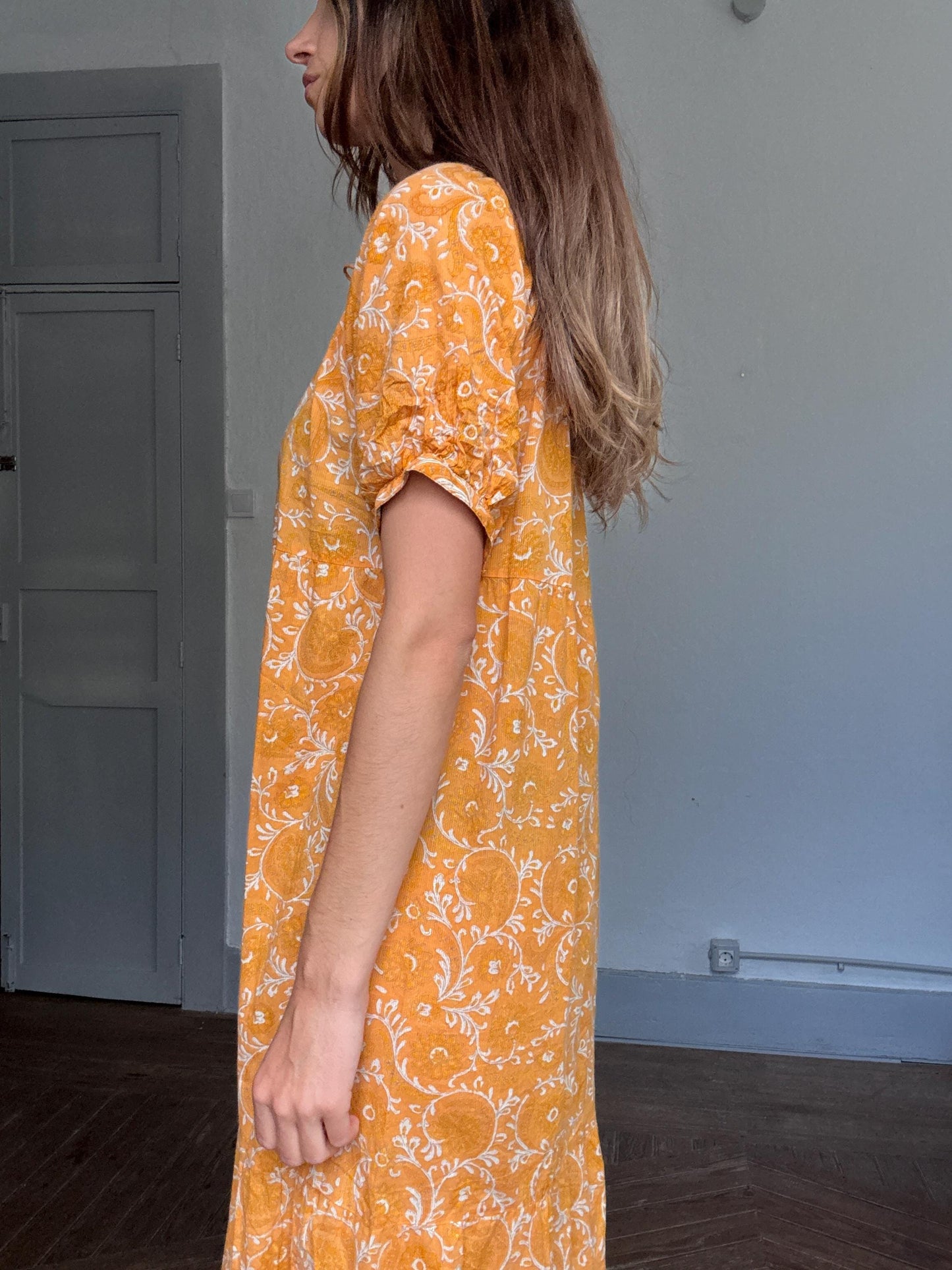 Natura floral maxi dress in 100% cotton – golden orange boho style, tiered silhouette, relaxed summer fit