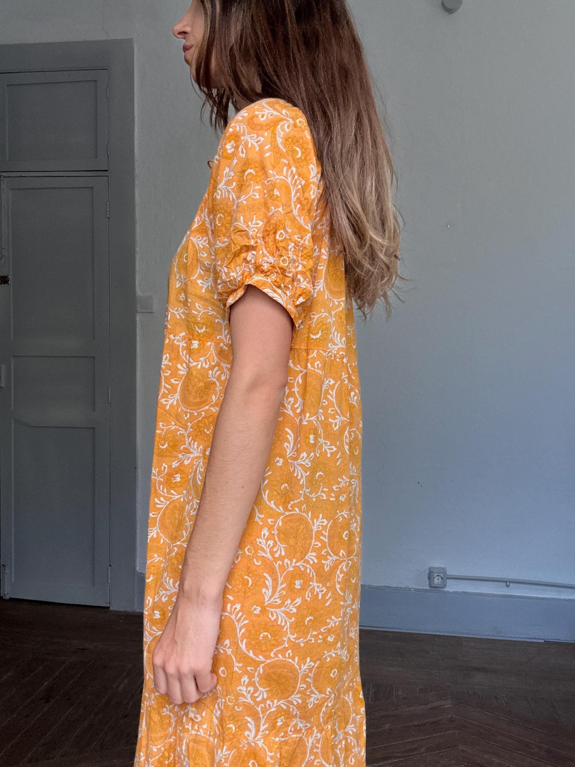 Natura floral maxi dress in 100% cotton – golden orange boho style, tiered silhouette, relaxed summer fit