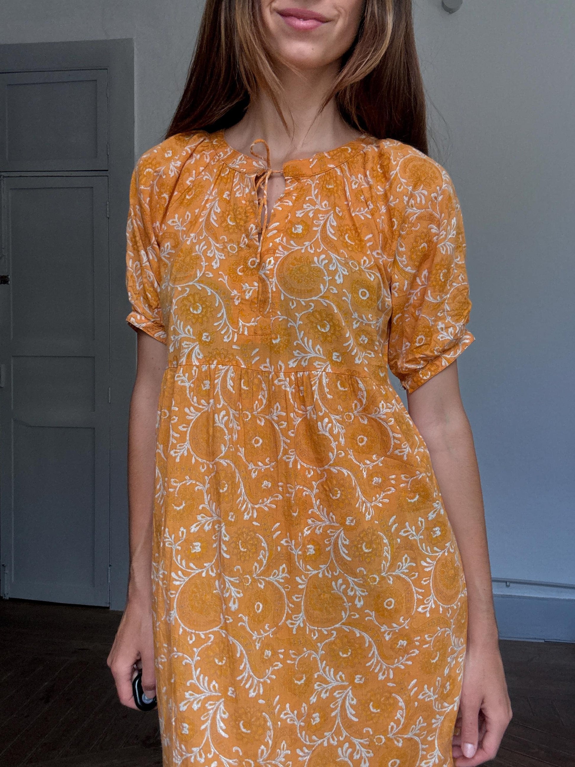 Natura floral maxi dress in 100% cotton – golden orange boho style, tiered silhouette, relaxed summer fit