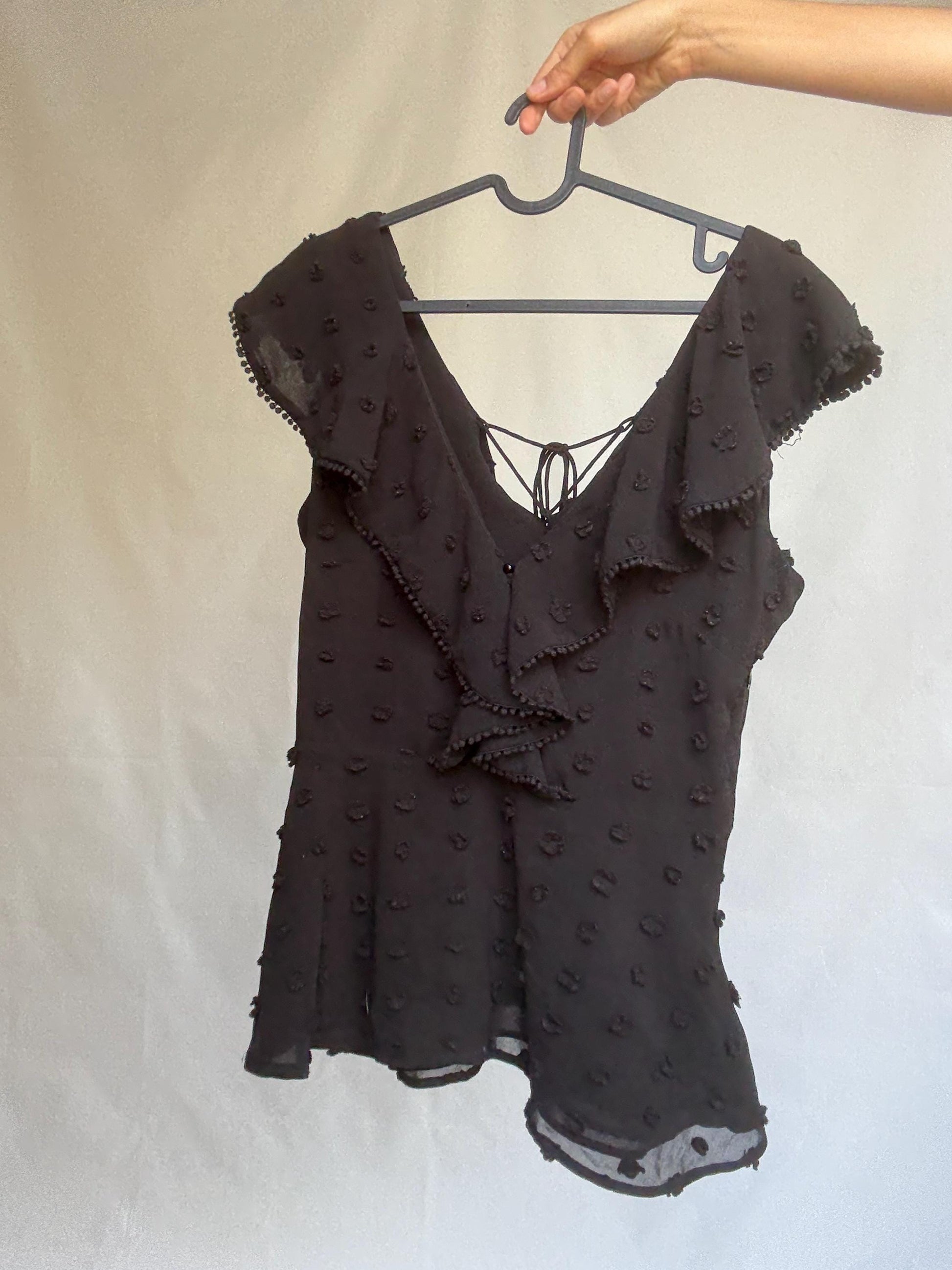Uterqüe black blouse with ruffled back tie, textured dot fabric, romantic v-neck top with side zip, size M