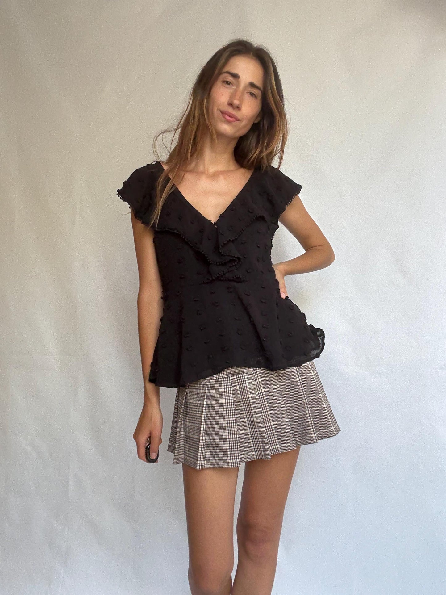 Uterqüe black blouse with ruffled back tie, textured dot fabric, romantic v-neck top with side zip, size M