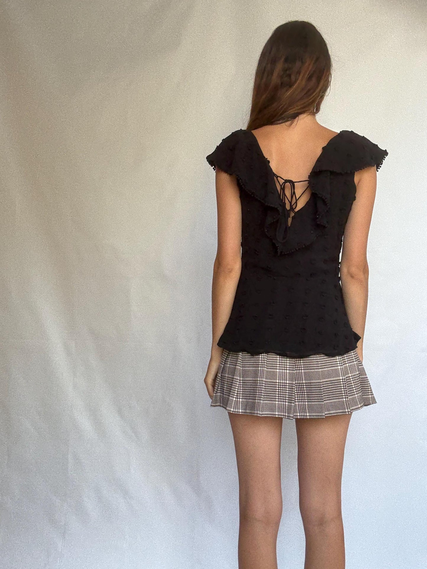 Uterqüe black blouse with ruffled back tie, textured dot fabric, romantic v-neck top with side zip, size M