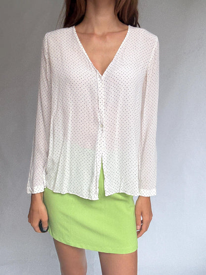White Polka Dot Button-Up Blouse — fabric close-up