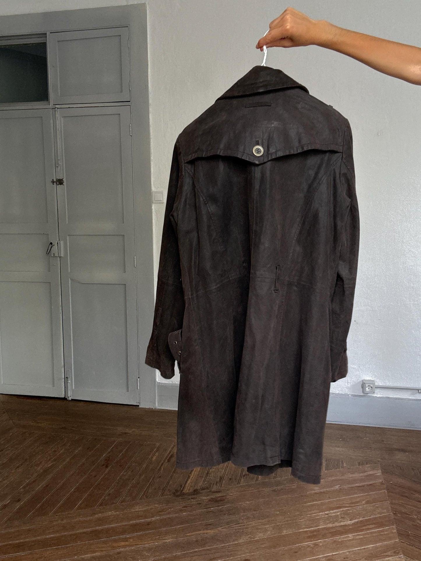 Matrix-Inspired Brown Leather Trench Coat — fabric close-up