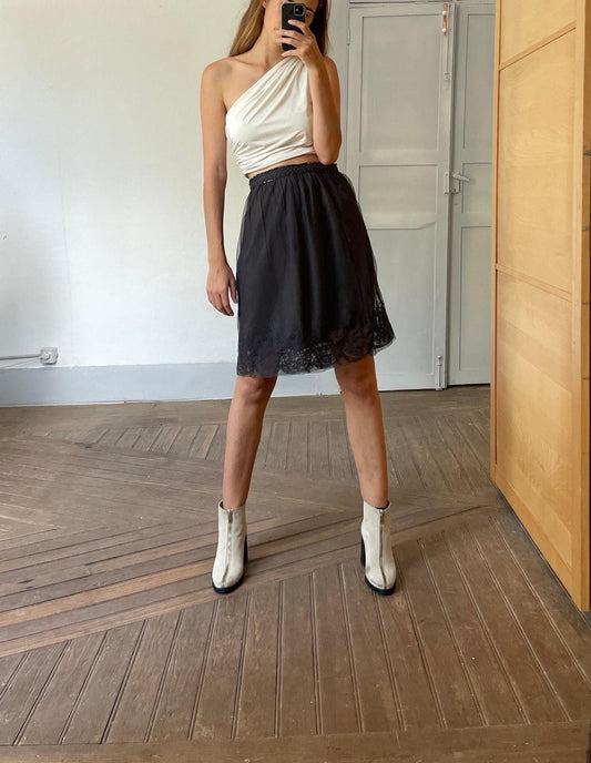 Black high waist fitting skirt with lace top layer and embelissments. Romantic aesthetic.