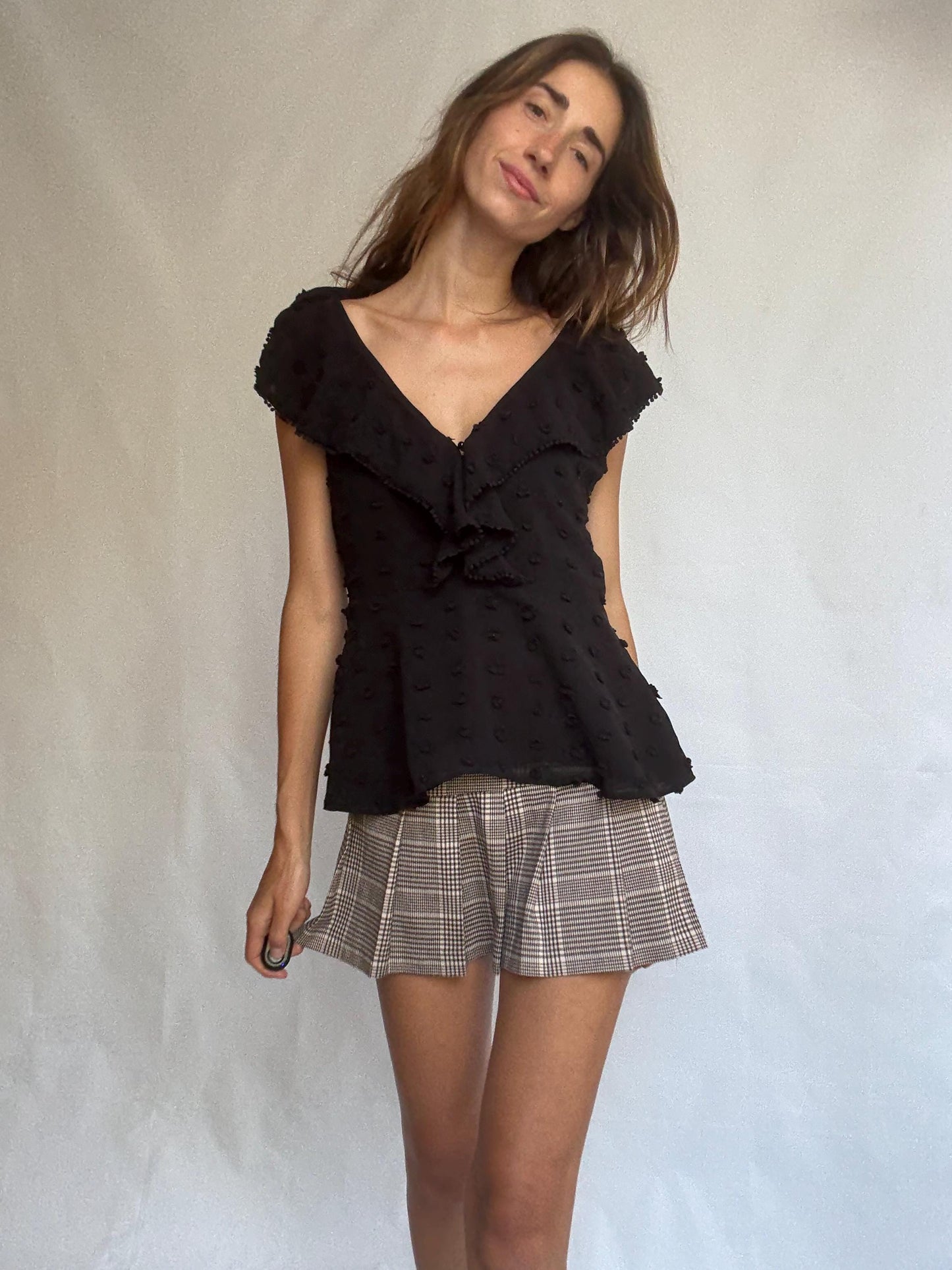 Uterqüe black blouse with ruffled back tie, textured dot fabric, romantic v-neck top with side zip, size M