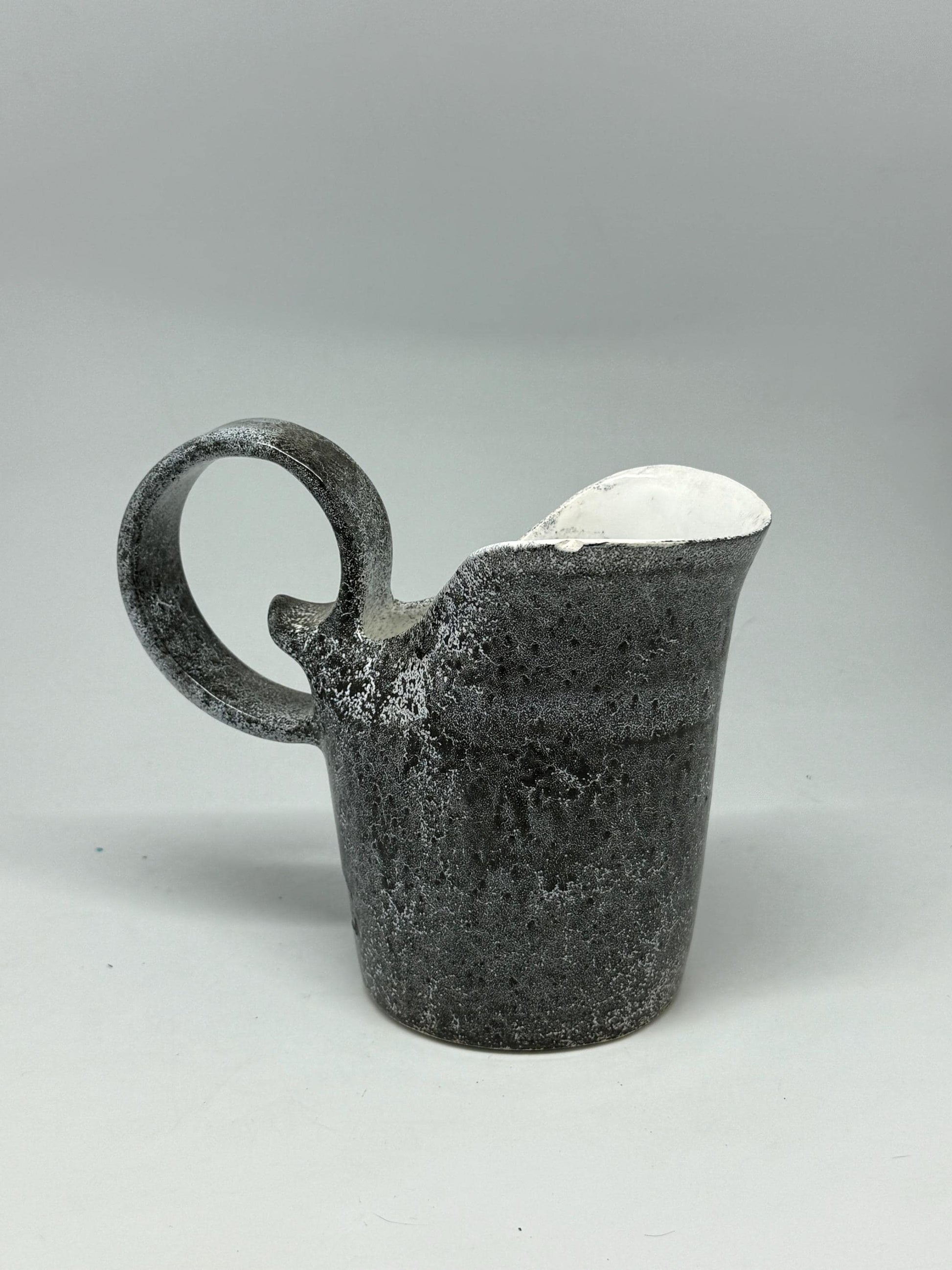 Vintage charcoal speckled ceramic creamer pitcher – sculptural swirl handle – 15cm tall – 10cm top width – rustic kitchen decor
