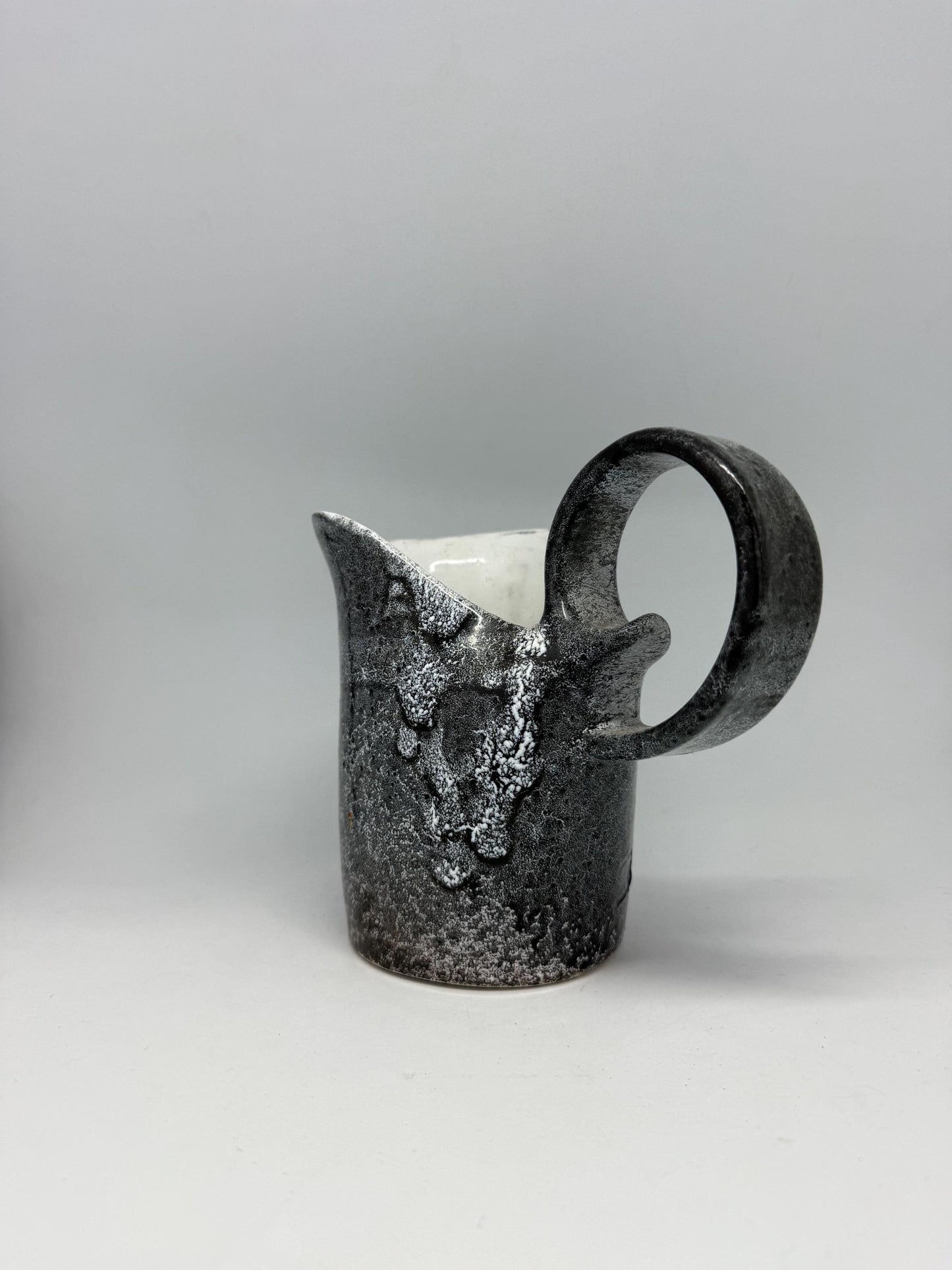 Vintage charcoal speckled ceramic creamer pitcher – sculptural swirl handle – 15cm tall – 10cm top width – rustic kitchen decor