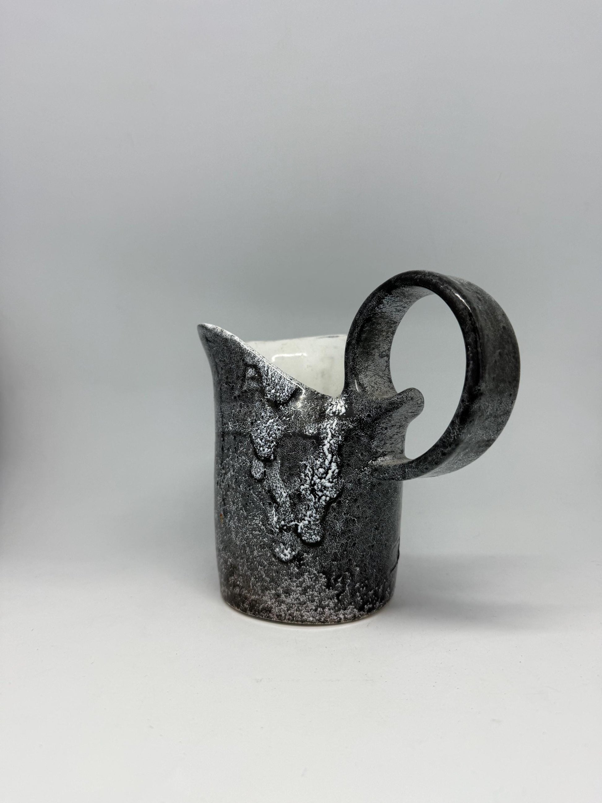 Vintage charcoal speckled ceramic creamer pitcher – sculptural swirl handle – 15cm tall – 10cm top width – rustic kitchen decor