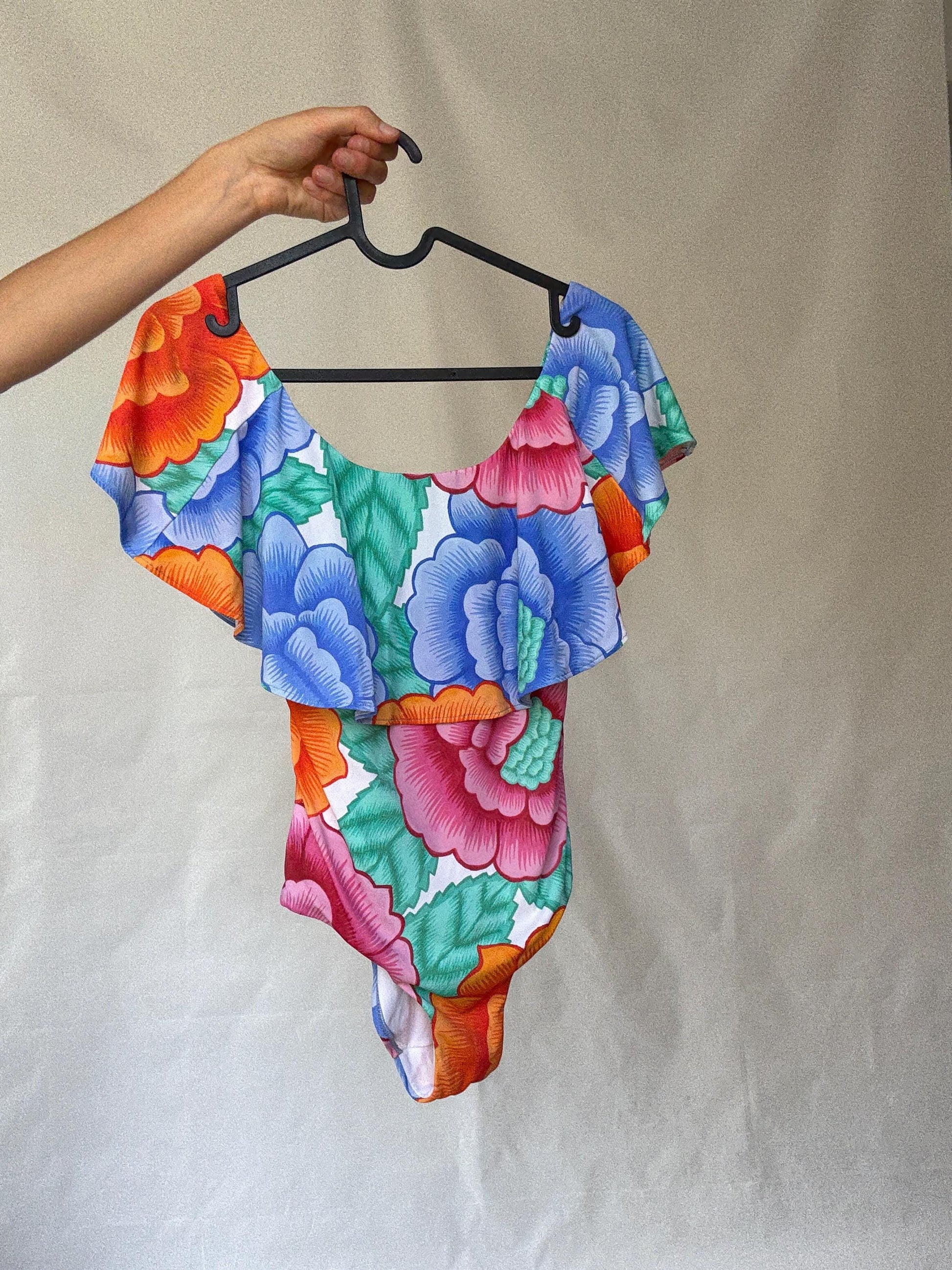 Retro floral one, piece swimsuit, scoop neckline, ruffled shoulder overlay, vibrant floral print, bohemian style, US M