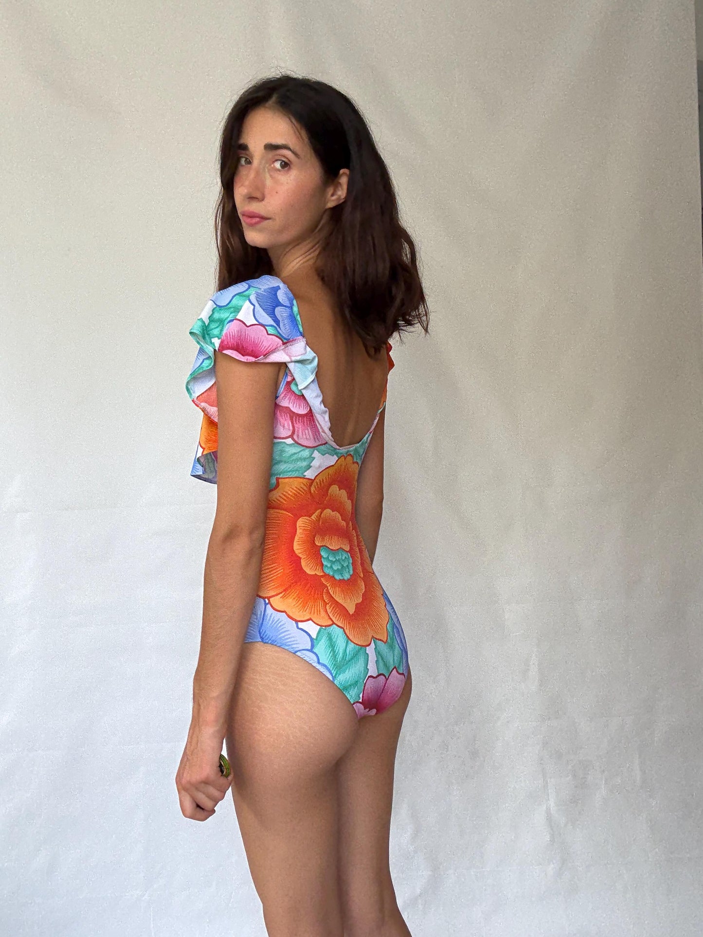 Retro floral one, piece swimsuit, scoop neckline, ruffled shoulder overlay, vibrant floral print, bohemian style, US M