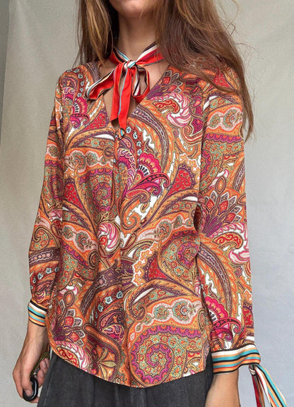 Ema Blue's Paisley Bow Blouse — fabric close-up