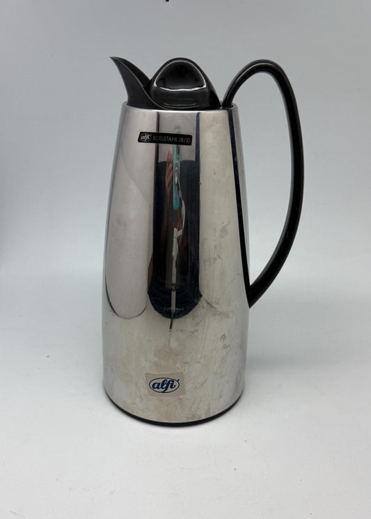 Modern stainless steel thermal carafe, double, wall insulation, sleek reflective finish, ergonomic handle, minimalist chic vibe