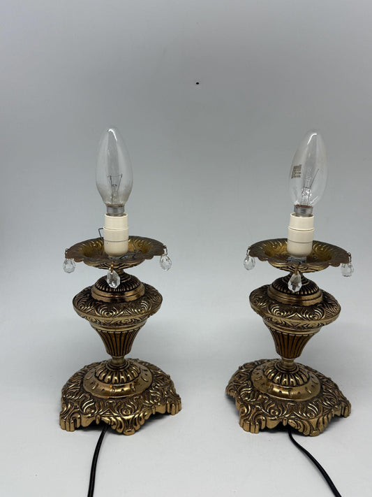 Vintage pair of ornate table lamps, metal with brass, tone finish, candle holders, hanging crystal accents, elegant antique style