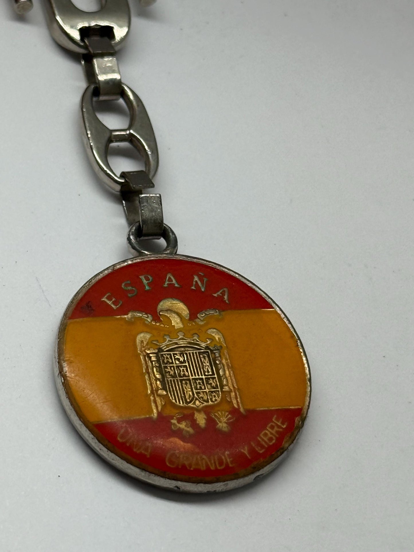 Vintage Spanish Coat of Arms Keychain, silver polished metal, medallion design, patriotic emblem, collectible item, stylish accessory