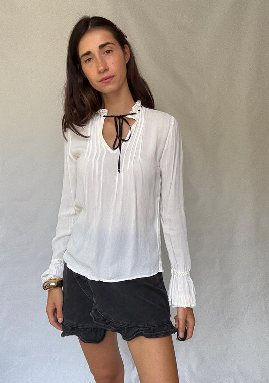 Romantic Bohemian White Blouse with Black Tie Detailing, Flowing Sleeves, and Ruffled V-Neck Inspired by Alexa Chung Style