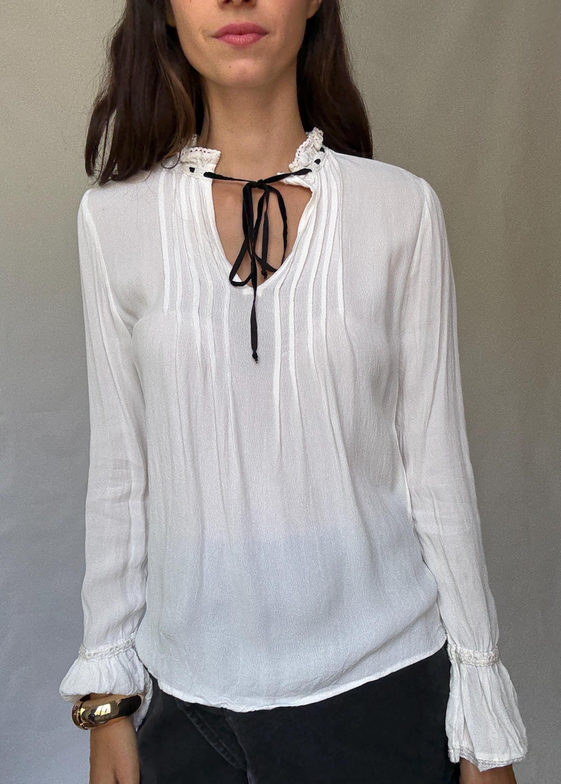 Romantic Bohemian White Blouse with Black Tie Detailing, Flowing Sleeves, and Ruffled V-Neck Inspired by Alexa Chung Style