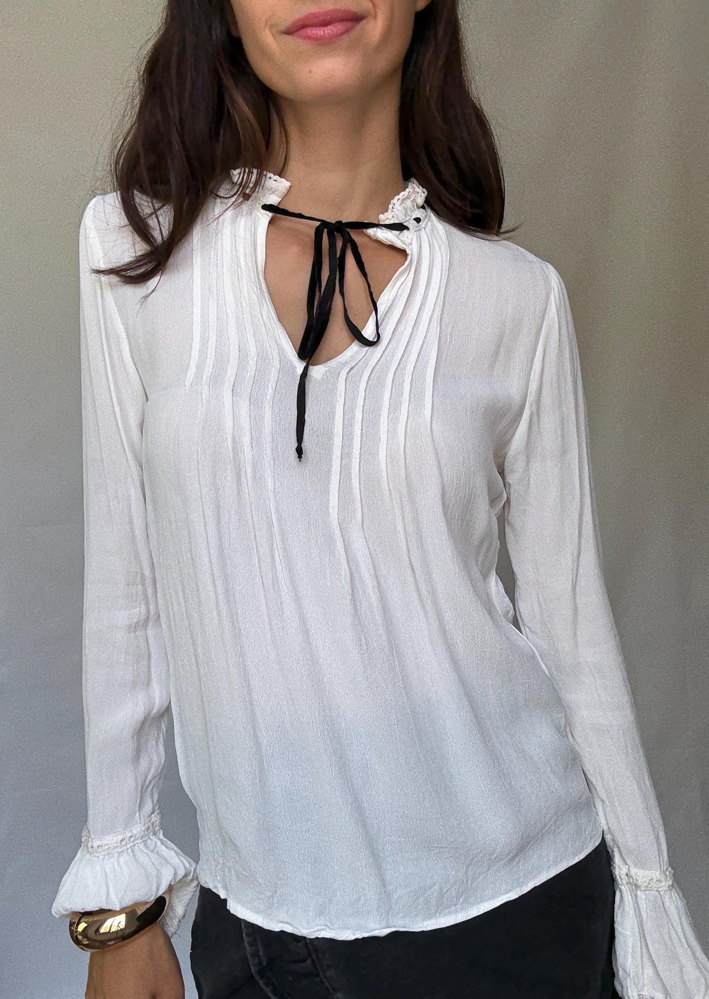 Romantic Bohemian White Blouse with Black Tie Detailing, Flowing Sleeves, and Ruffled V-Neck Inspired by Alexa Chung Style