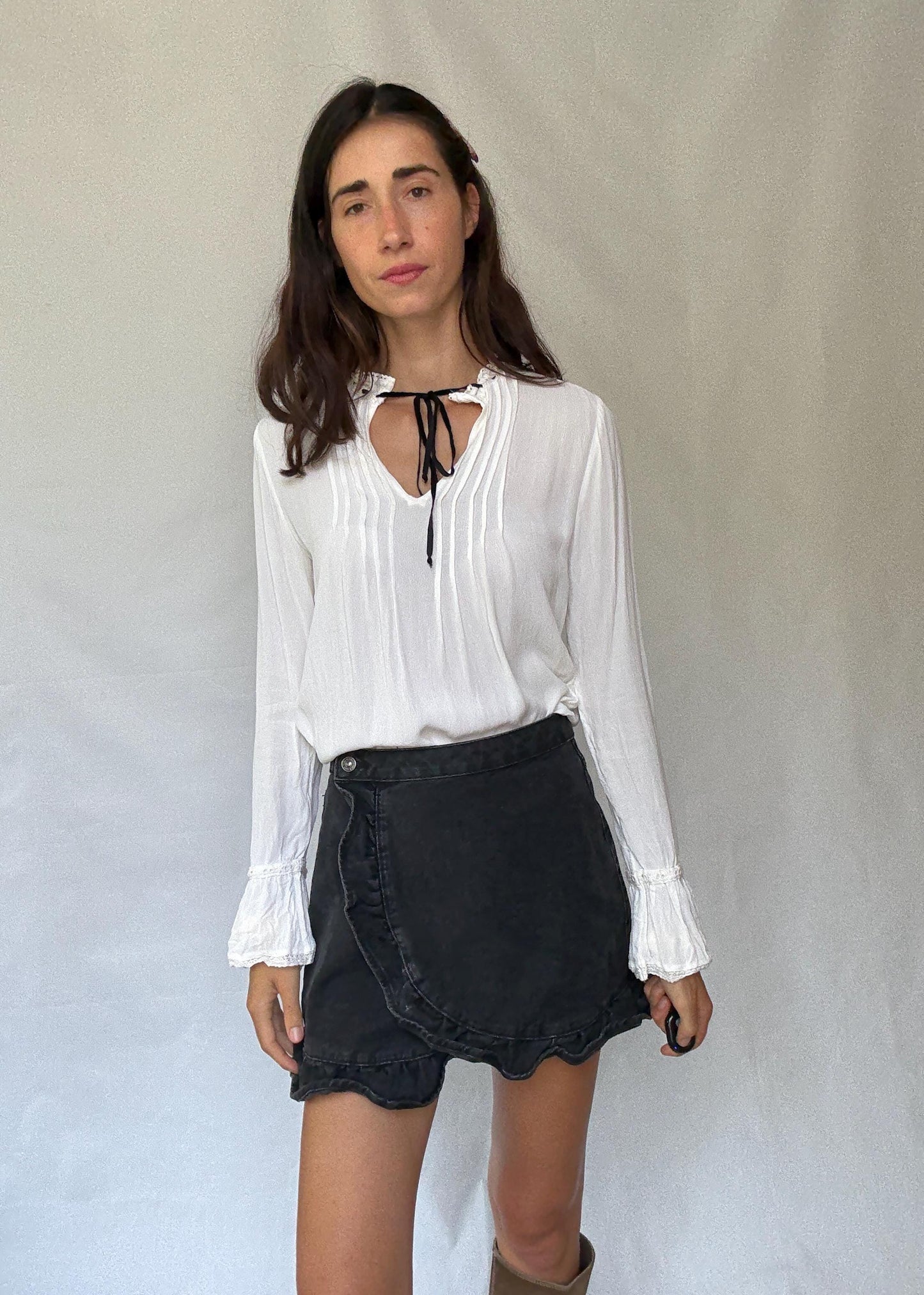 Romantic Bohemian White Blouse with Black Tie Detailing, Flowing Sleeves, and Ruffled V-Neck Inspired by Alexa Chung Style