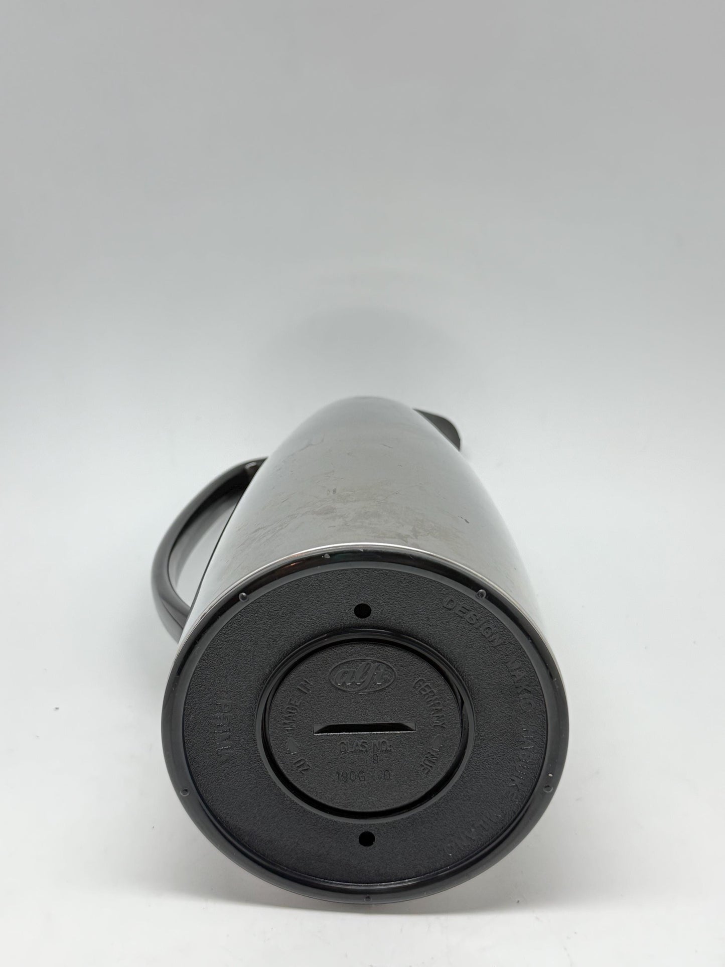 Modern stainless steel thermal carafe, double, wall insulation, sleek reflective finish, ergonomic handle, minimalist chic vibe