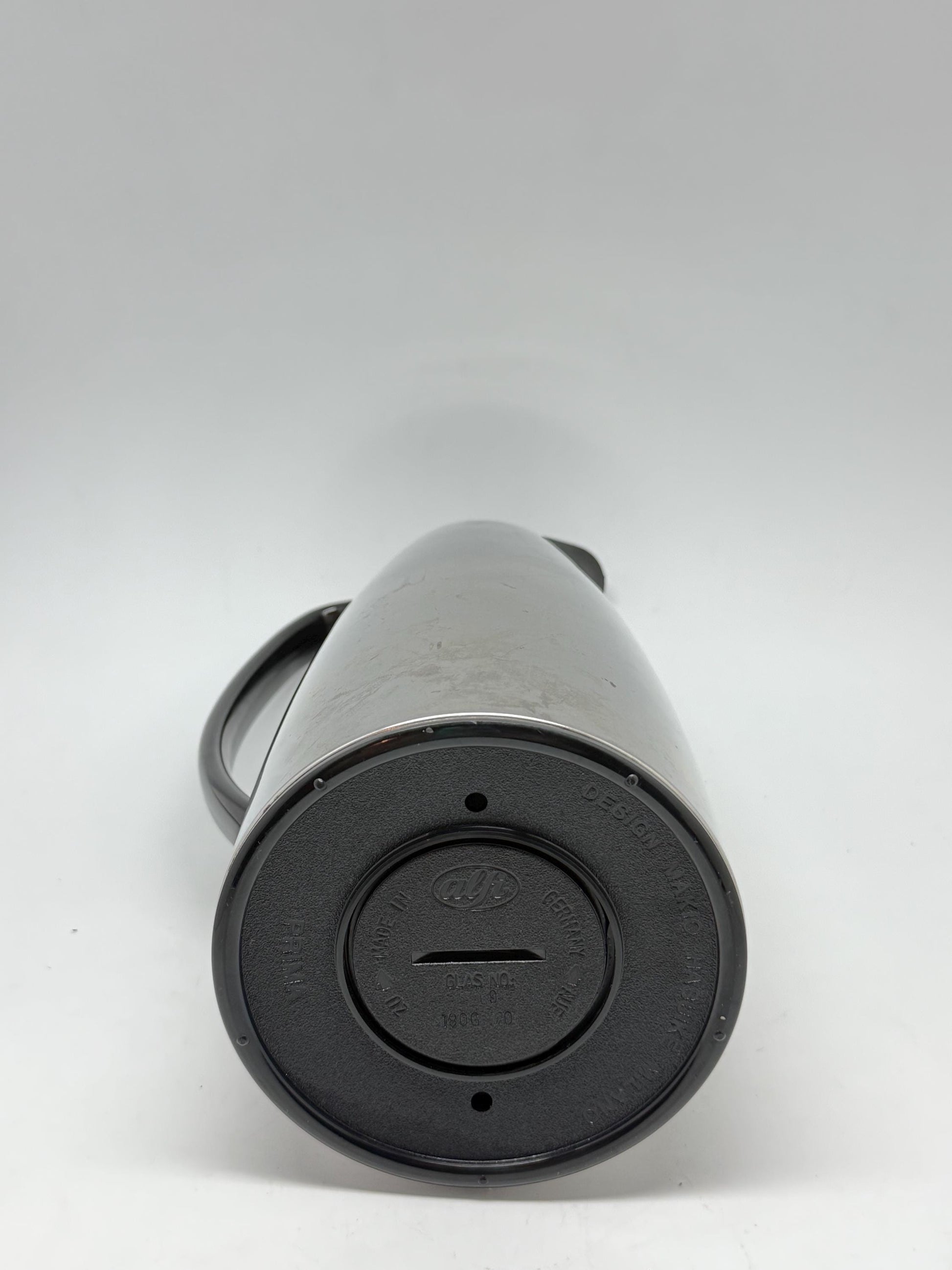 Modern stainless steel thermal carafe, double, wall insulation, sleek reflective finish, ergonomic handle, minimalist chic vibe