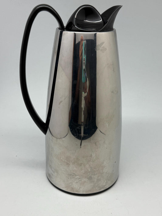 Modern stainless steel thermal carafe, double, wall insulation, sleek reflective finish, ergonomic handle, minimalist chic vibe