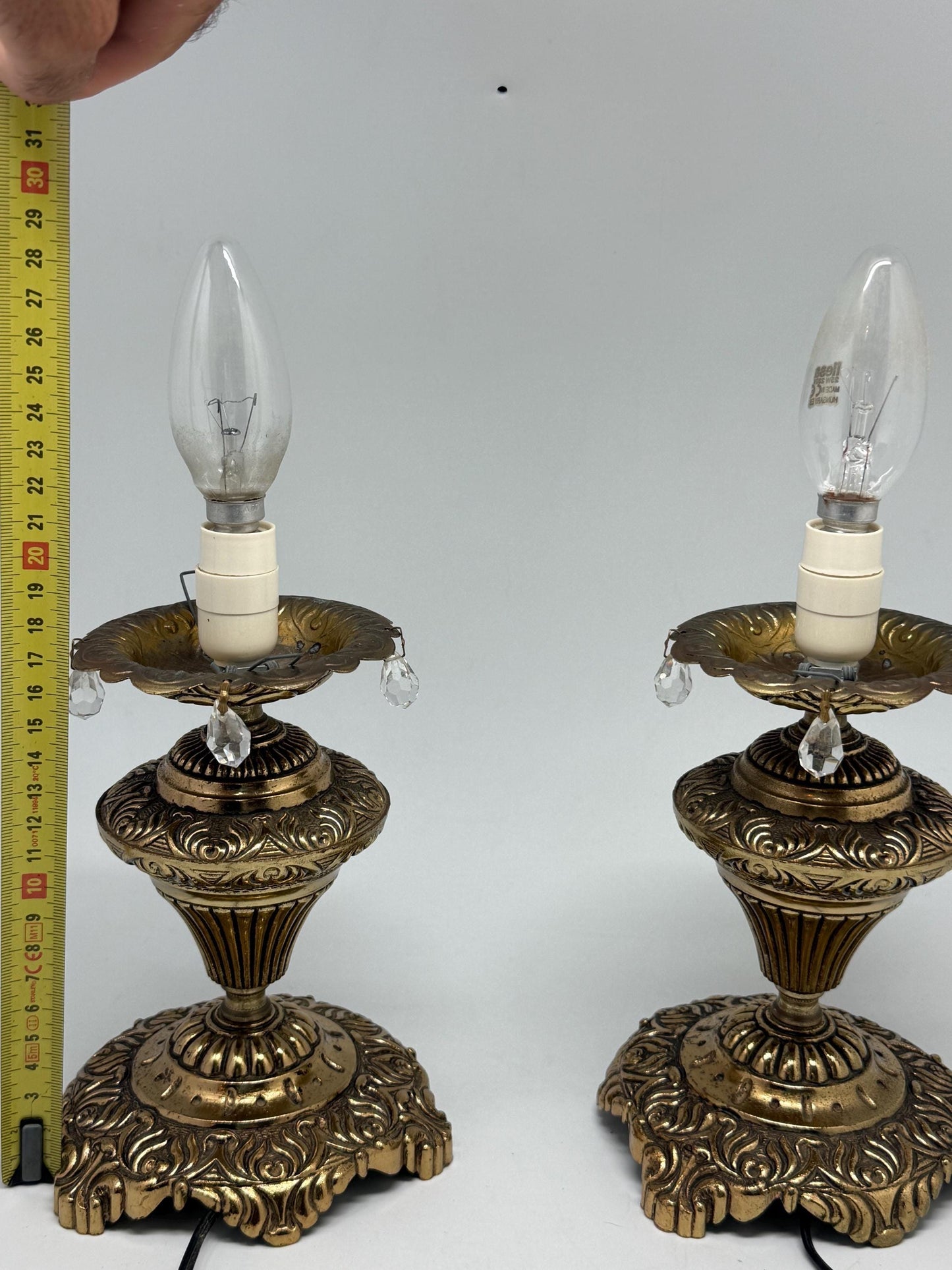 Vintage pair of ornate table lamps, metal with brass, tone finish, candle holders, hanging crystal accents, elegant antique style