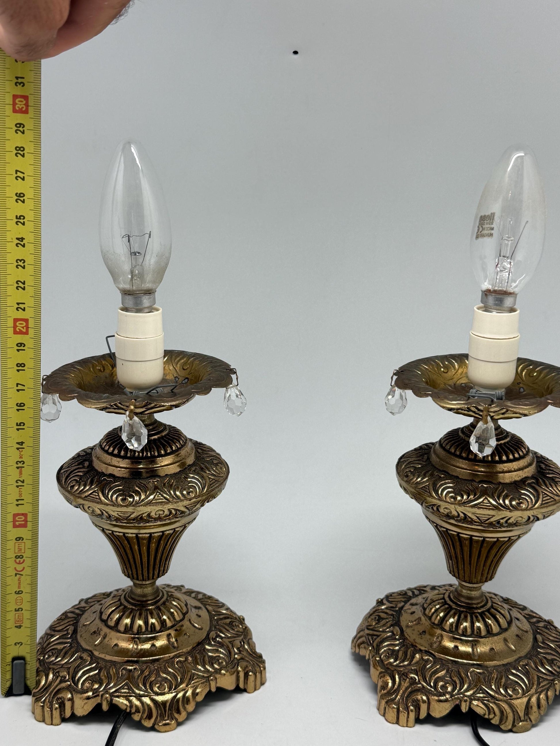 Vintage pair of ornate table lamps, metal with brass, tone finish, candle holders, hanging crystal accents, elegant antique style