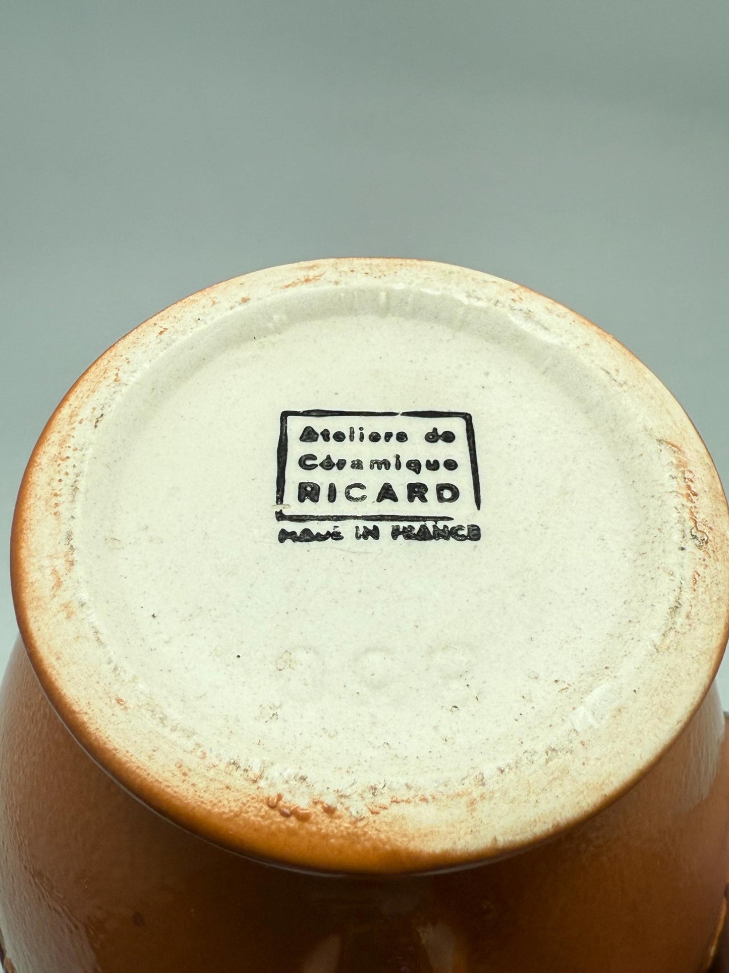 Vintage terracotta Ricard pitcher, ceramic feel, rounded glossy body, iconic branding, retro 80s vibe, tabletop decor