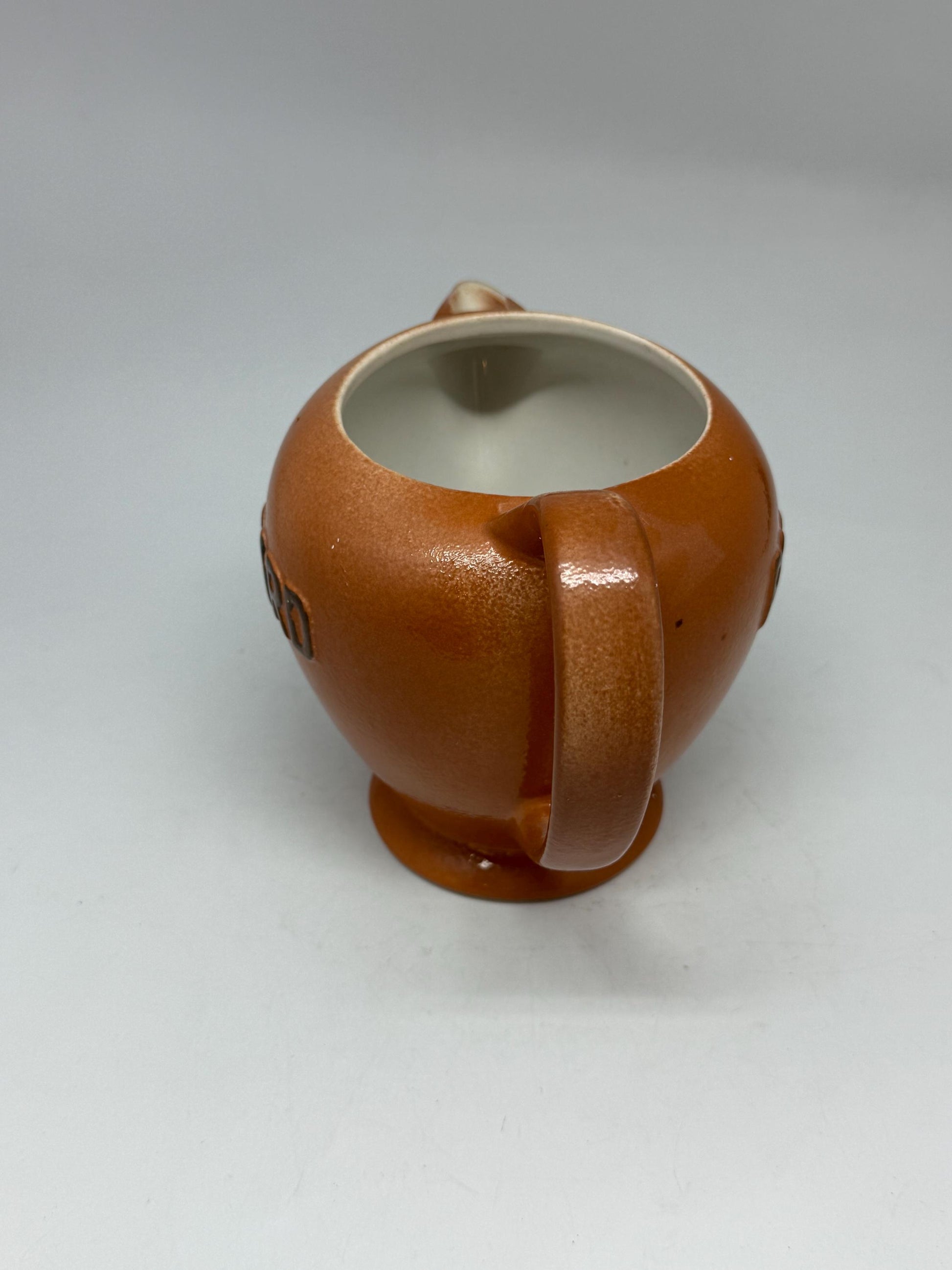 Vintage terracotta Ricard pitcher, ceramic feel, rounded glossy body, iconic branding, retro 80s vibe, tabletop decor
