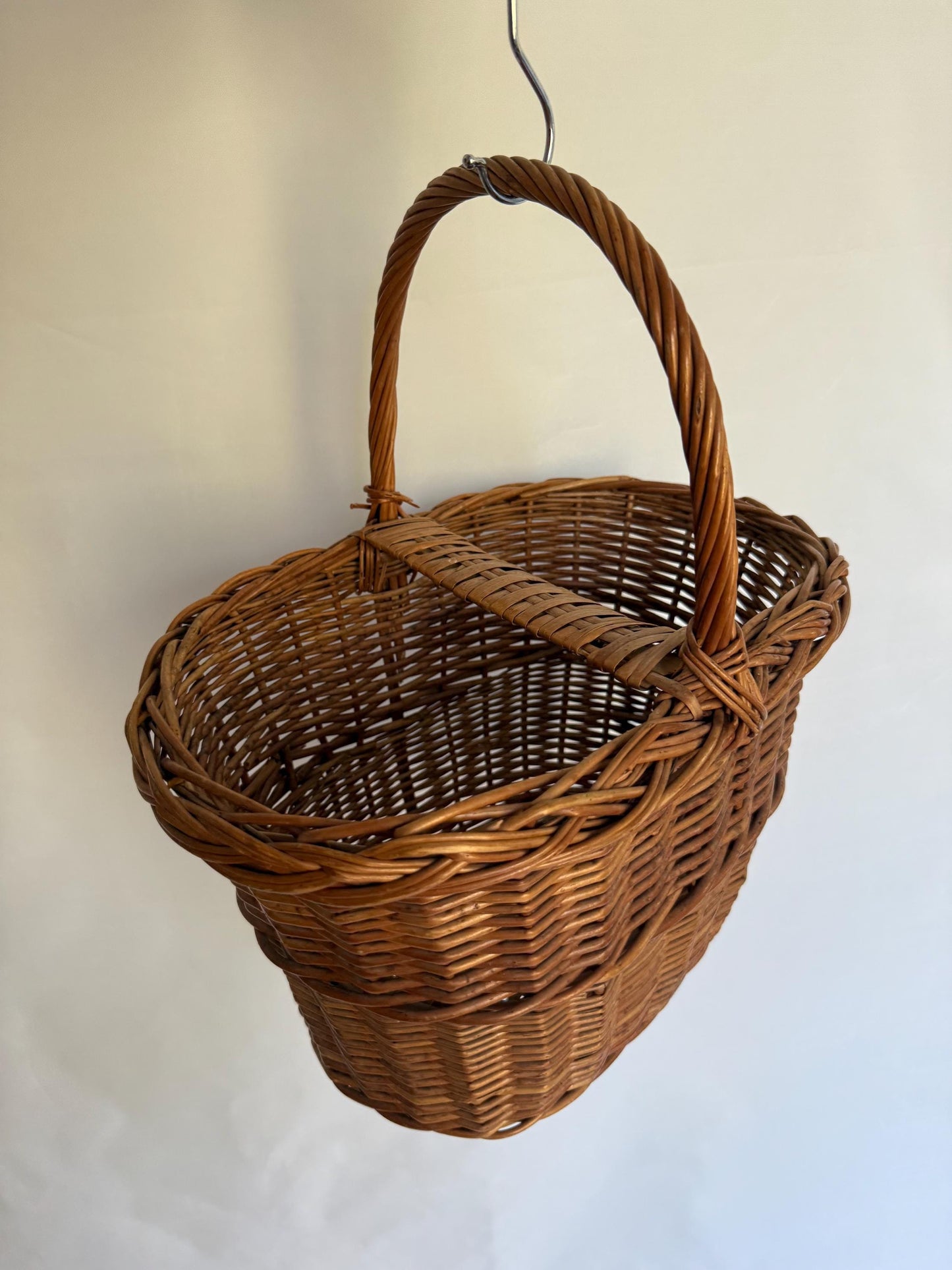 Rustic rattan basket, natural woven design, classic silhouette, autumn basket, crisscross pattern, rustic charm, picnic or storage