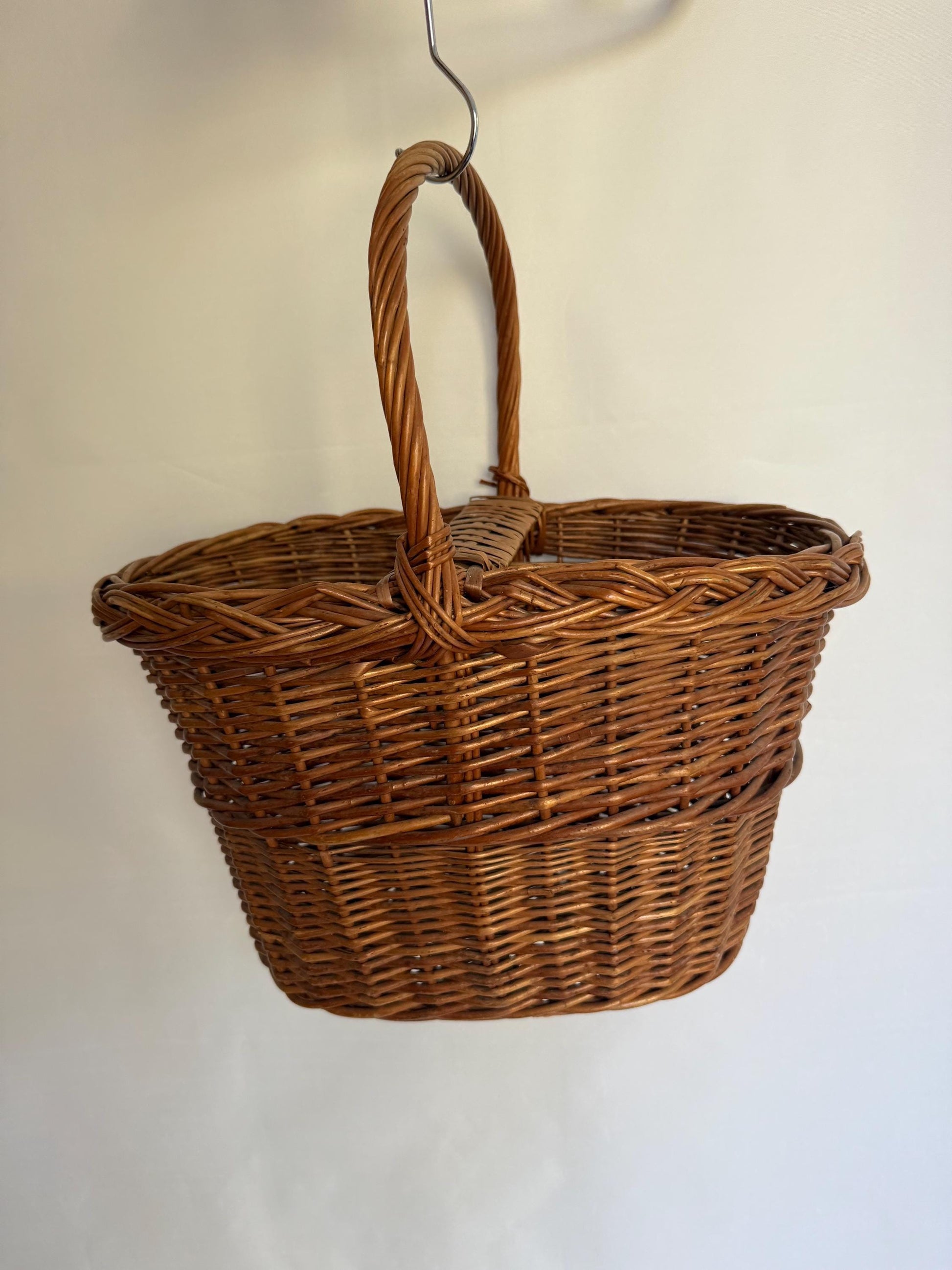 Rustic rattan basket, natural woven design, classic silhouette, autumn basket, crisscross pattern, rustic charm, picnic or storage