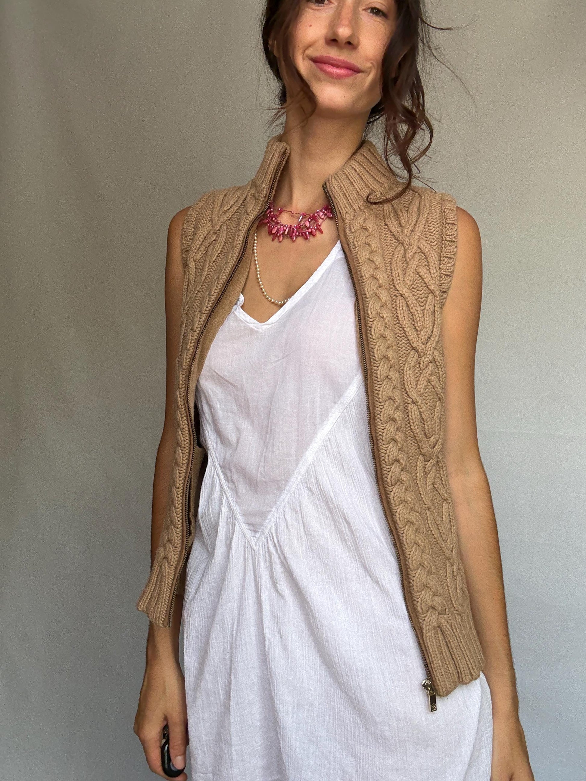 Massimo Dutti beige knit vest, wool Italian yarn, fitted silhouette, cable knit pattern, high ribbed collar, elegant Timothée Chalamet vibe