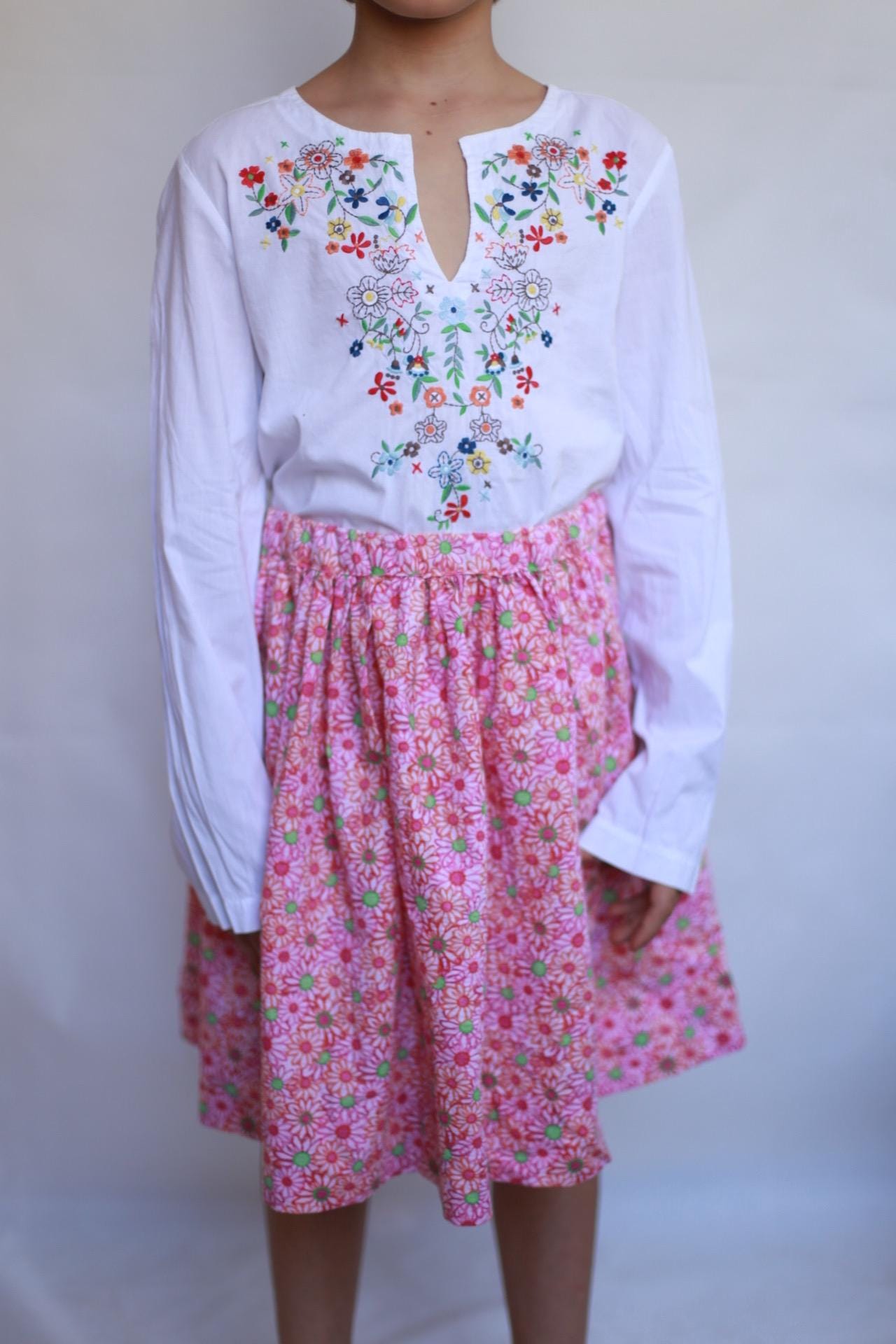 Vintage white children's blouse, cotton feel, relaxed fit, hand embroidered detail, minimalist folkloric aesthetic, US 10, EU 154 kids